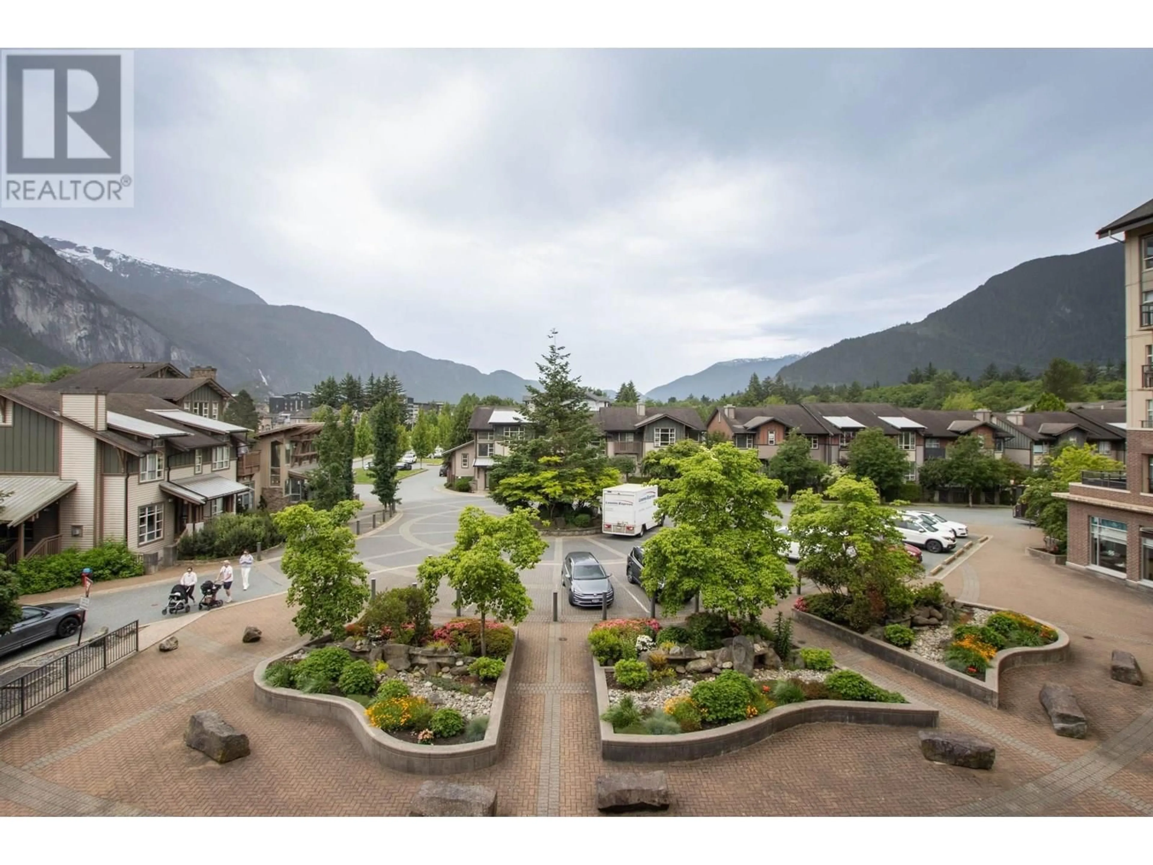 A pic from outside/outdoor area/front of a property/back of a property/a pic from drone, mountain view for 320 - 1211 VILLAGE GREEN WAY, Squamish British Columbia V8B0R7