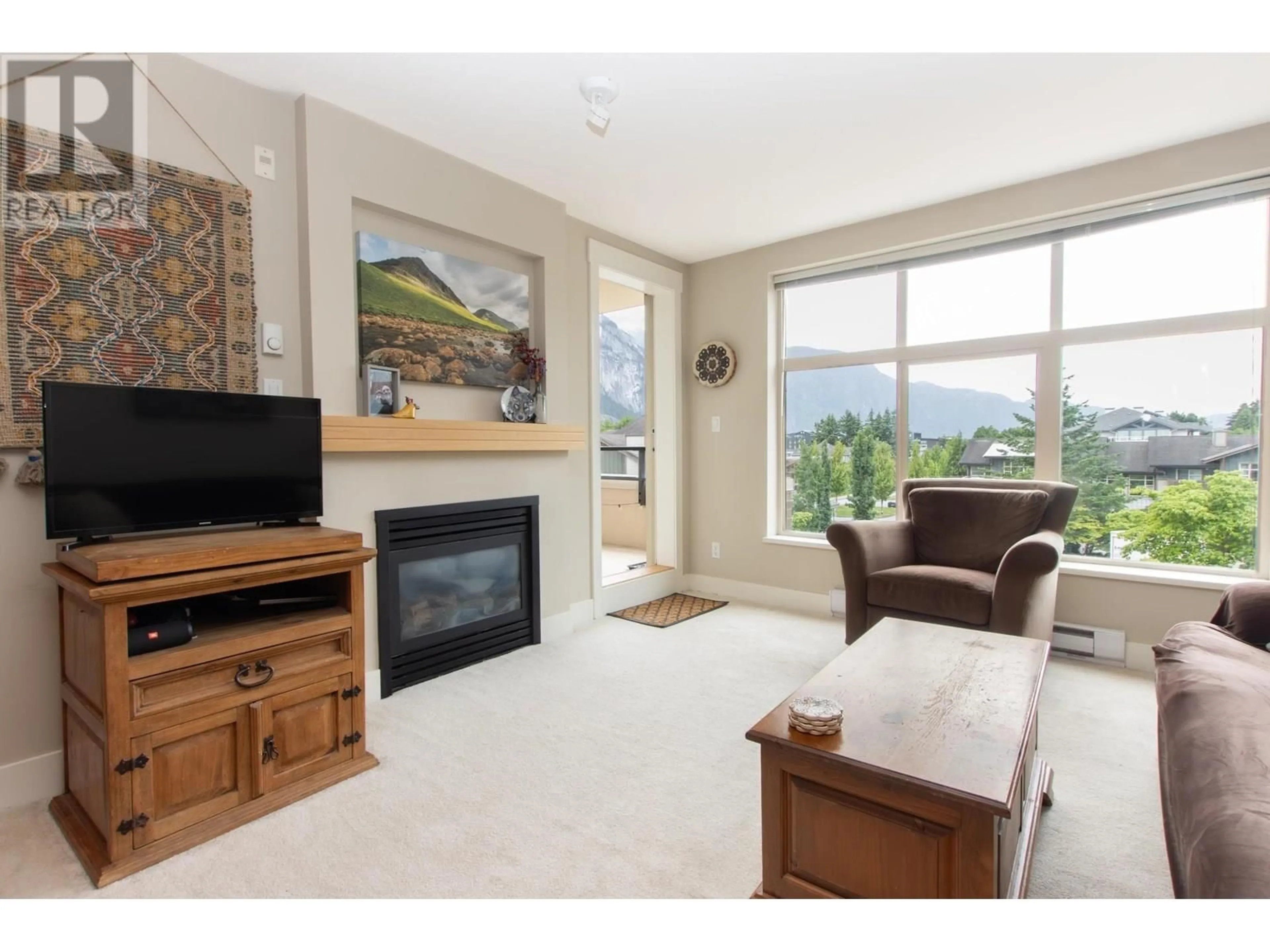 Living room with furniture, unknown for 320 - 1211 VILLAGE GREEN WAY, Squamish British Columbia V8B0R7