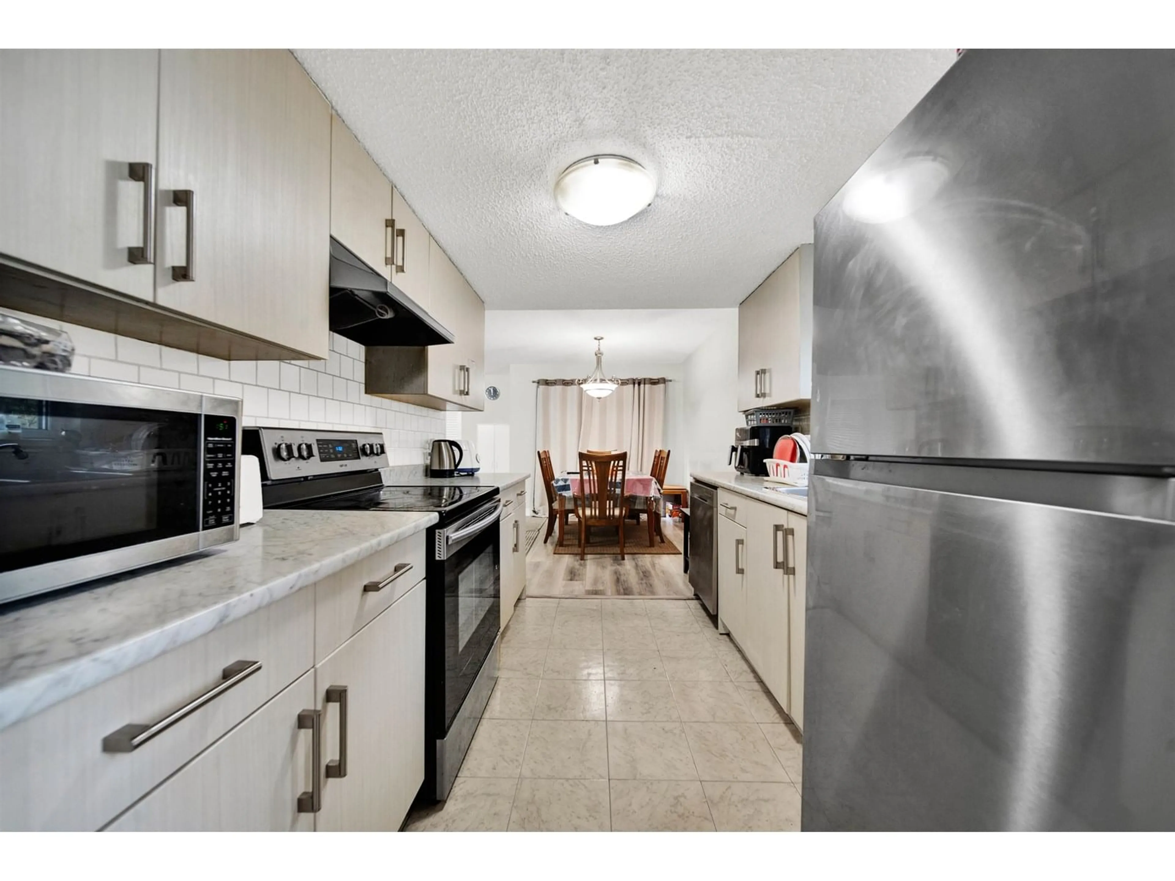 Standard kitchen, ceramic/tile floor for 104 - 13275 70B, Surrey British Columbia V3W7Z2