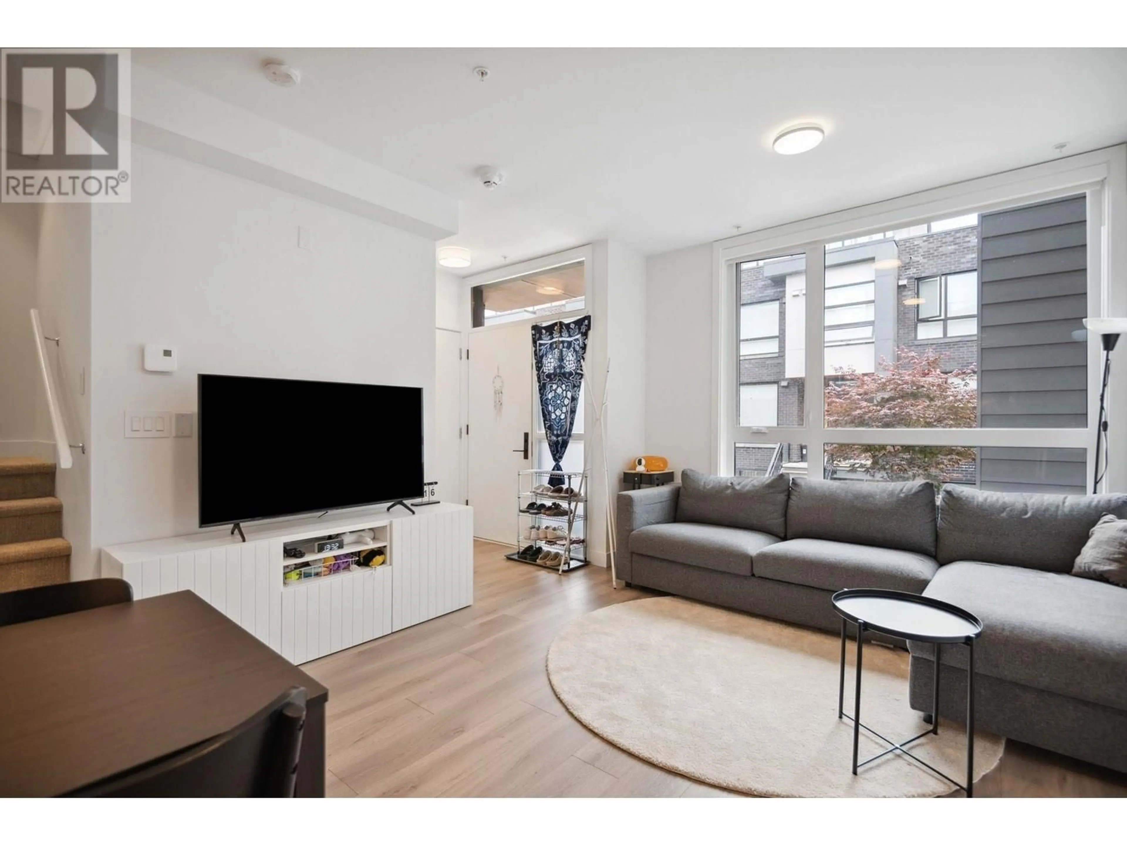 Living room with furniture, unknown for 206 - 6085 IRMIN STREET, Burnaby British Columbia V5J5C5