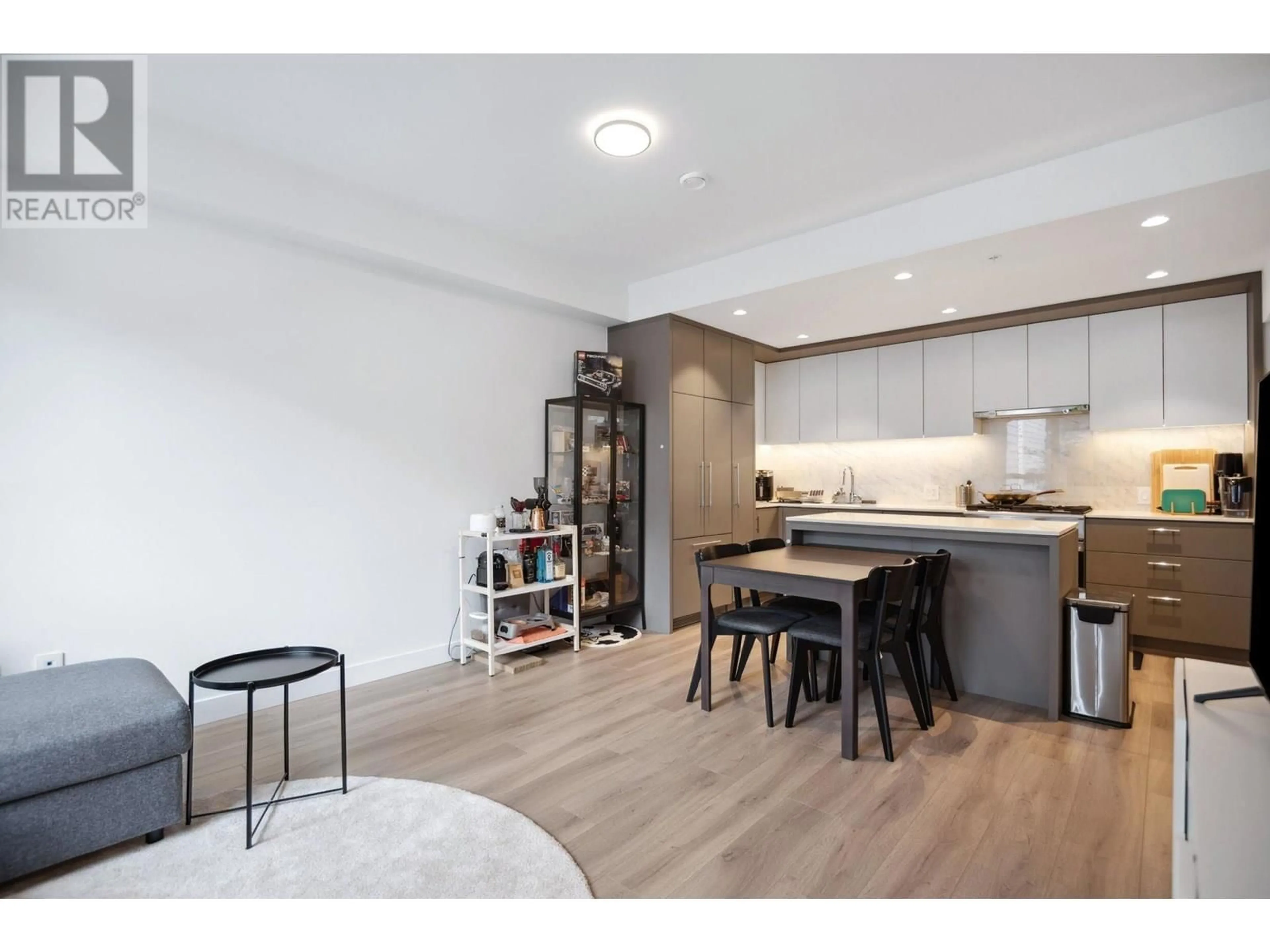 Open concept kitchen, wood/laminate floor for 206 - 6085 IRMIN STREET, Burnaby British Columbia V5J5C5