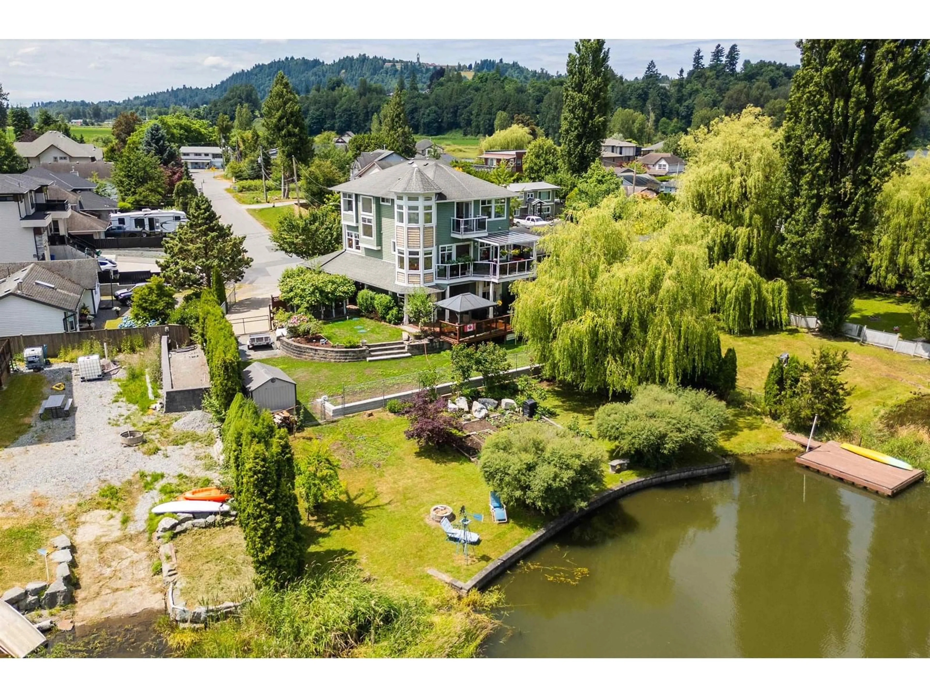 A pic from outside/outdoor area/front of a property/back of a property/a pic from drone, water/lake/river/ocean view for 8408 BENBOW, Mission British Columbia V2V7L6