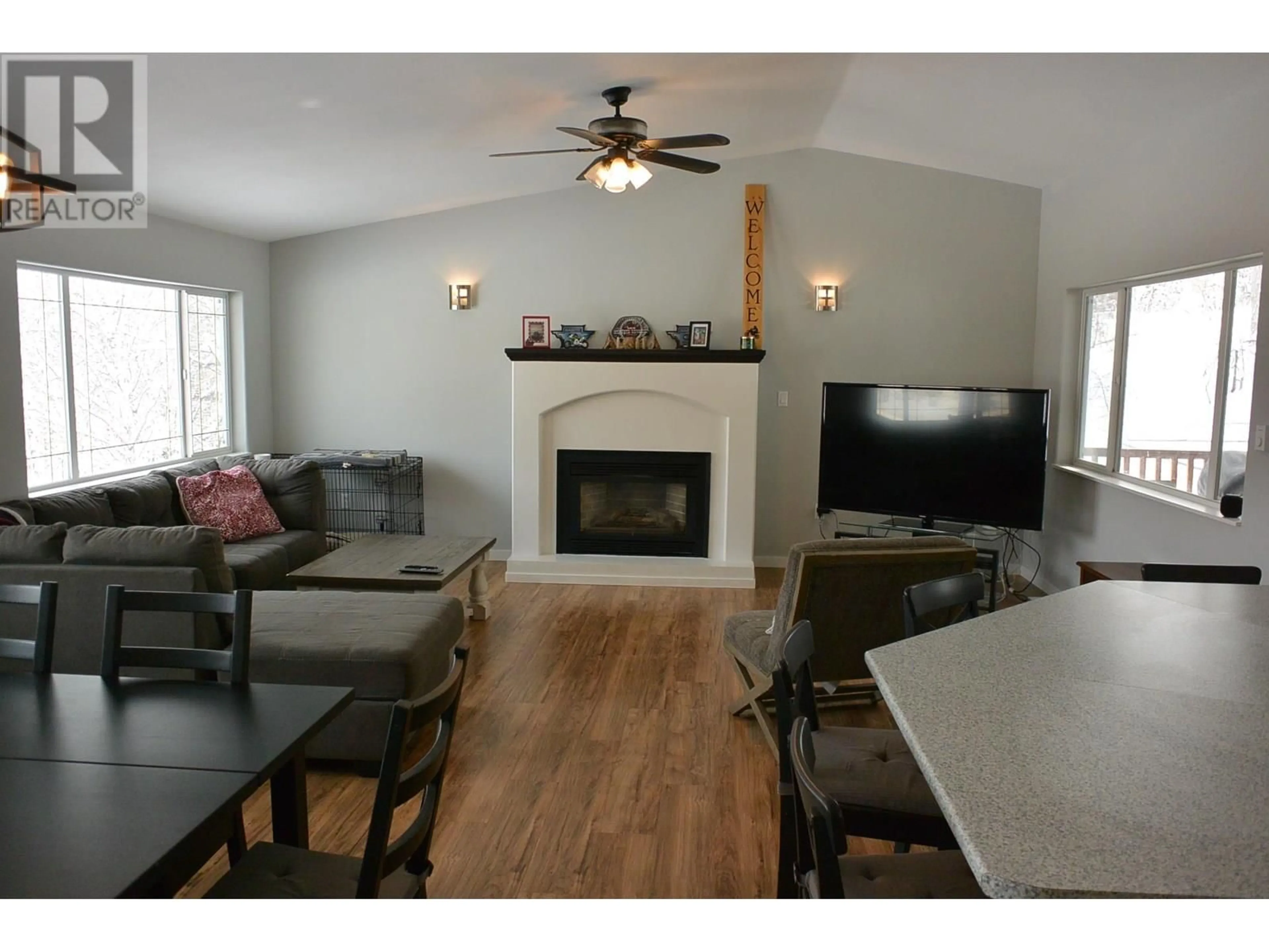 Living room with furniture, wood/laminate floor for 127 GEMINI STREET, Quesnel British Columbia V2J5X8