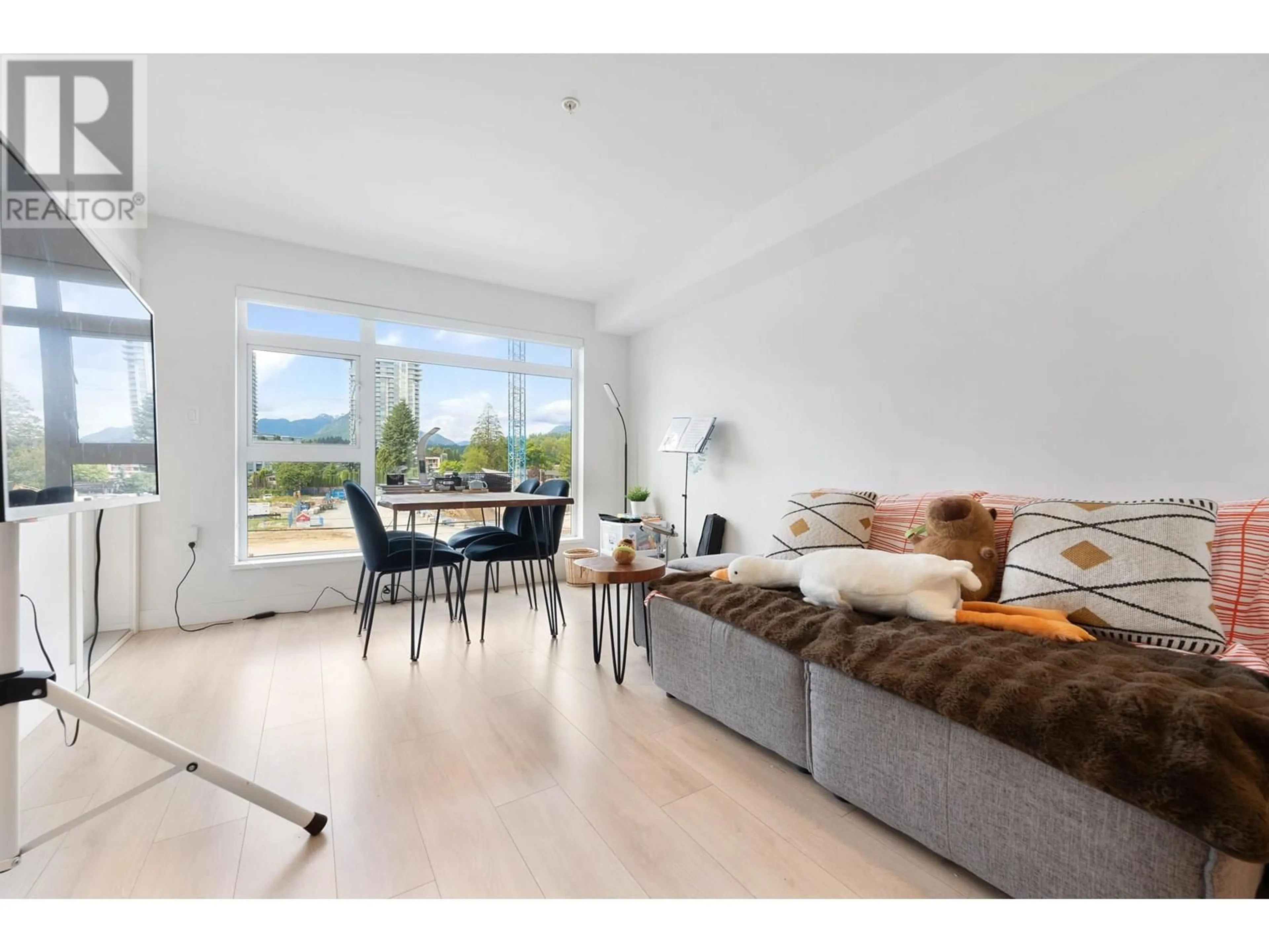 Living room with furniture, wood/laminate floor for 309 - 1519 CROWN STREET, North Vancouver British Columbia V7J1G6