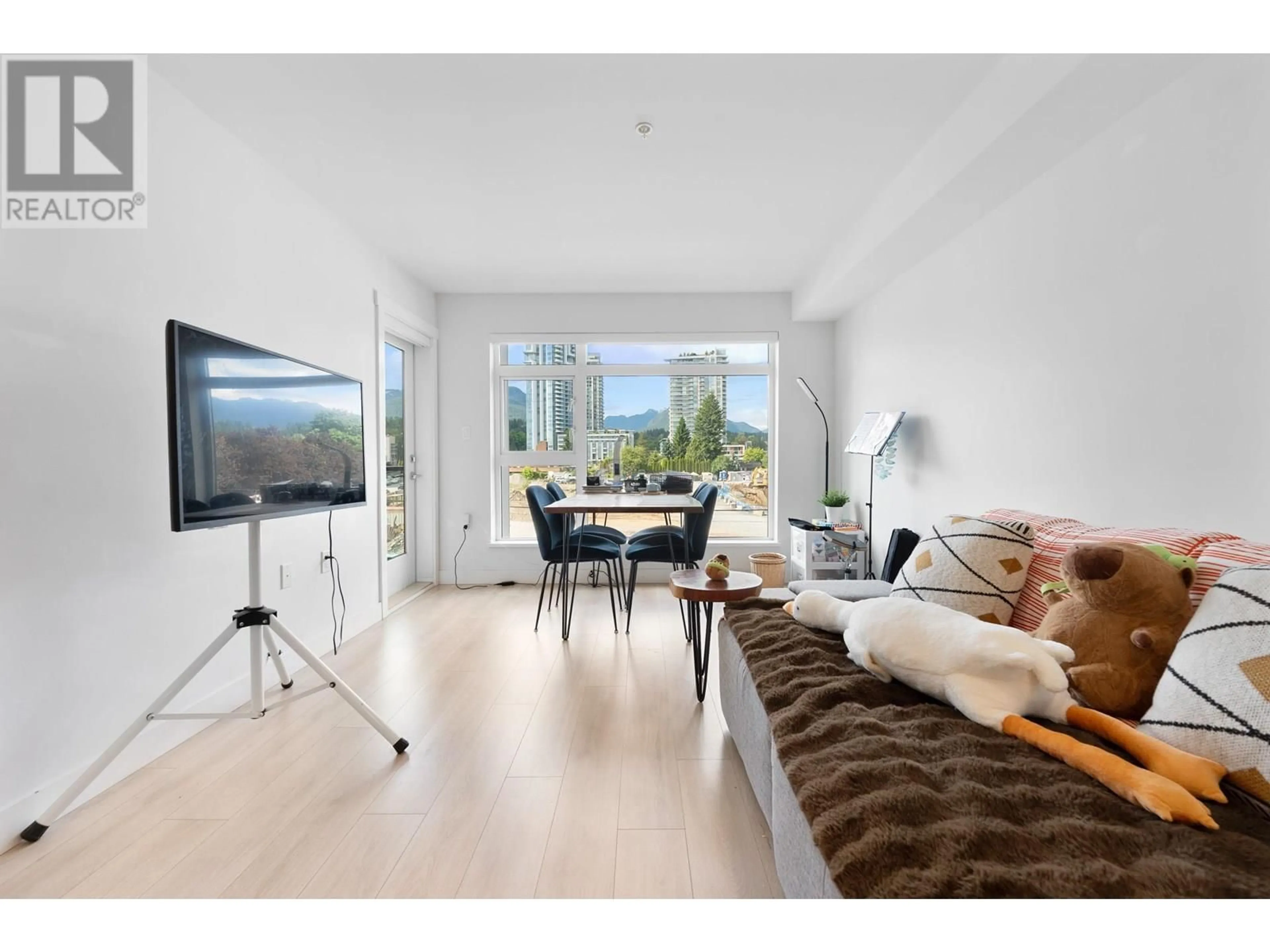 Living room with furniture, wood/laminate floor for 309 - 1519 CROWN STREET, North Vancouver British Columbia V7J1G6