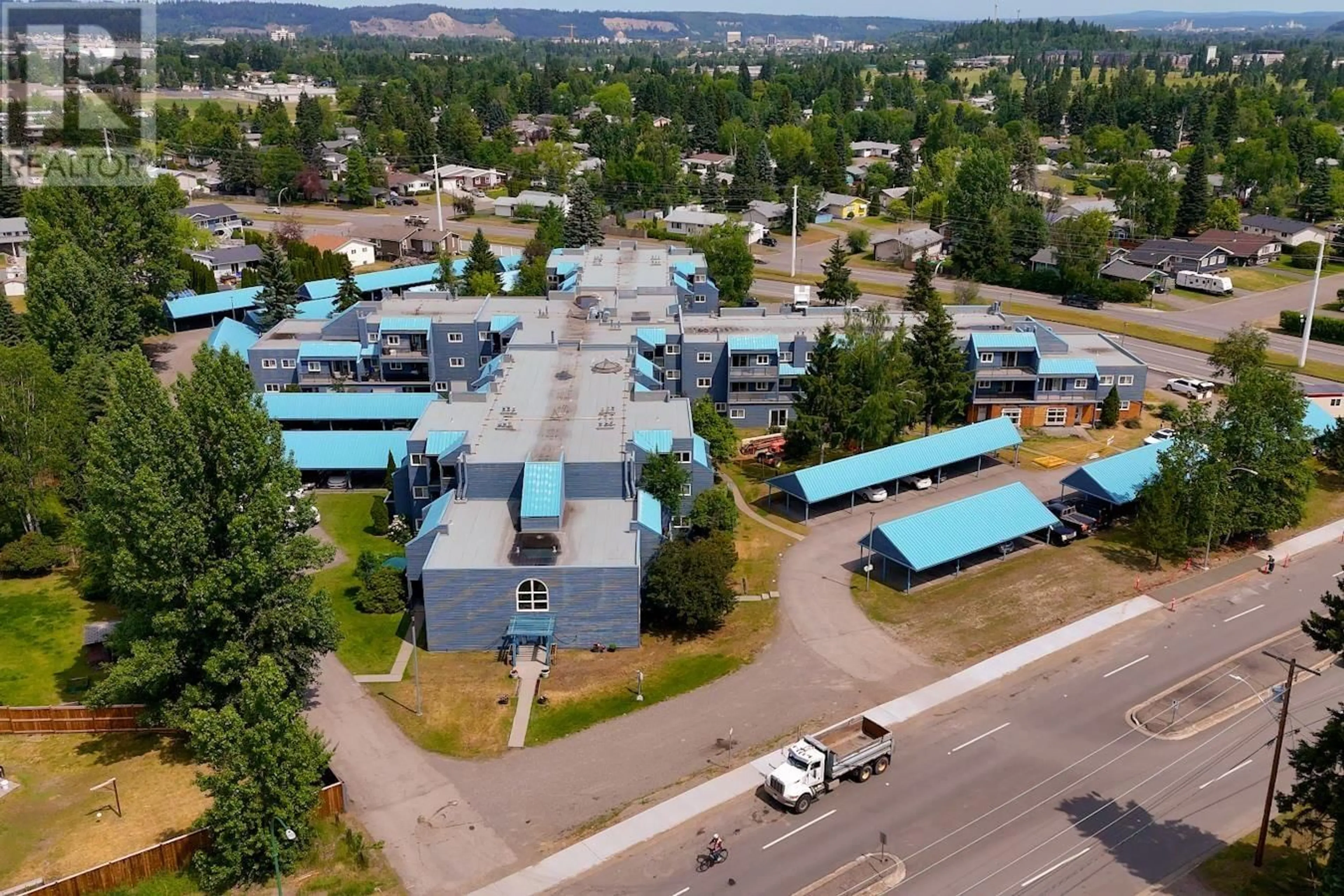 A pic from outside/outdoor area/front of a property/back of a property/a pic from drone, mountain view for 211 - 3033 OSPIKA BOULEVARD, Prince George British Columbia V2N4L5