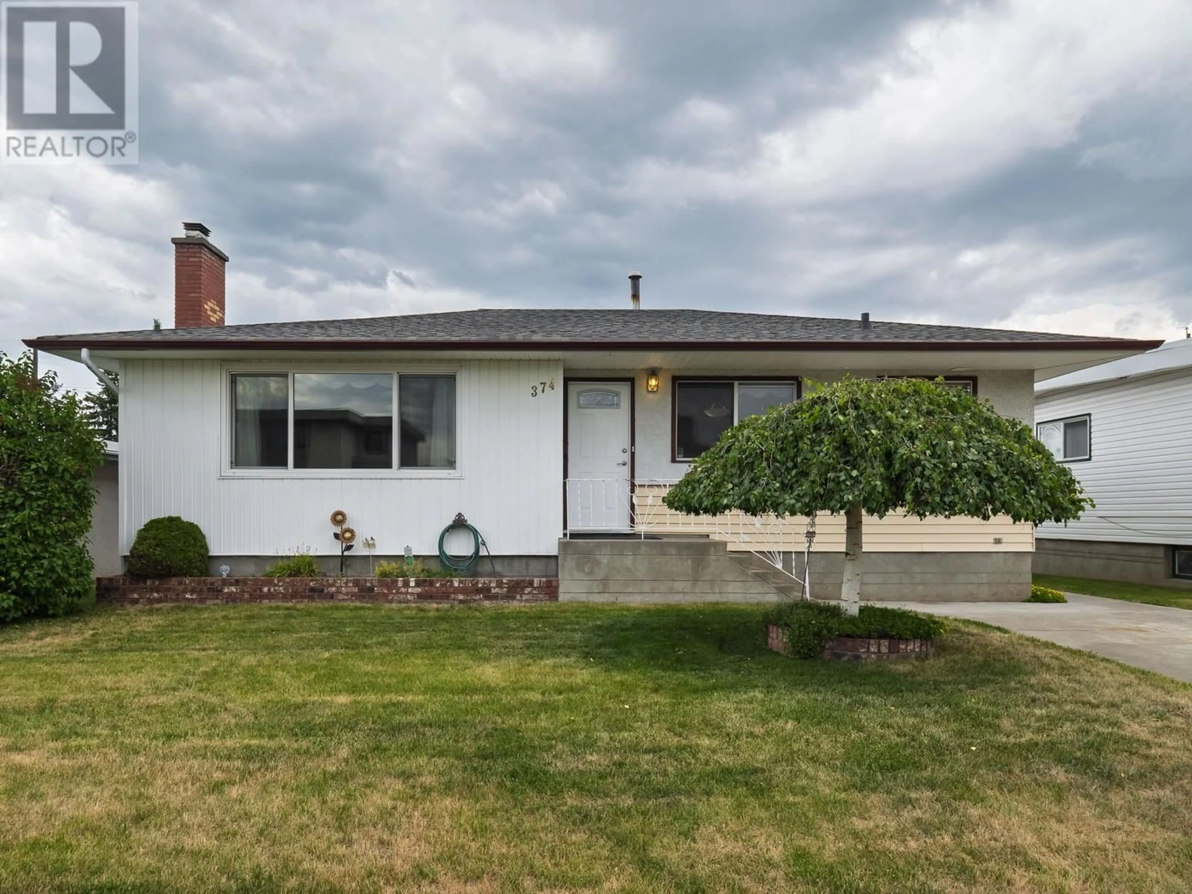 Home with vinyl exterior material, street for 374 NICHOLSON STREET, Prince George British Columbia V2M3L9