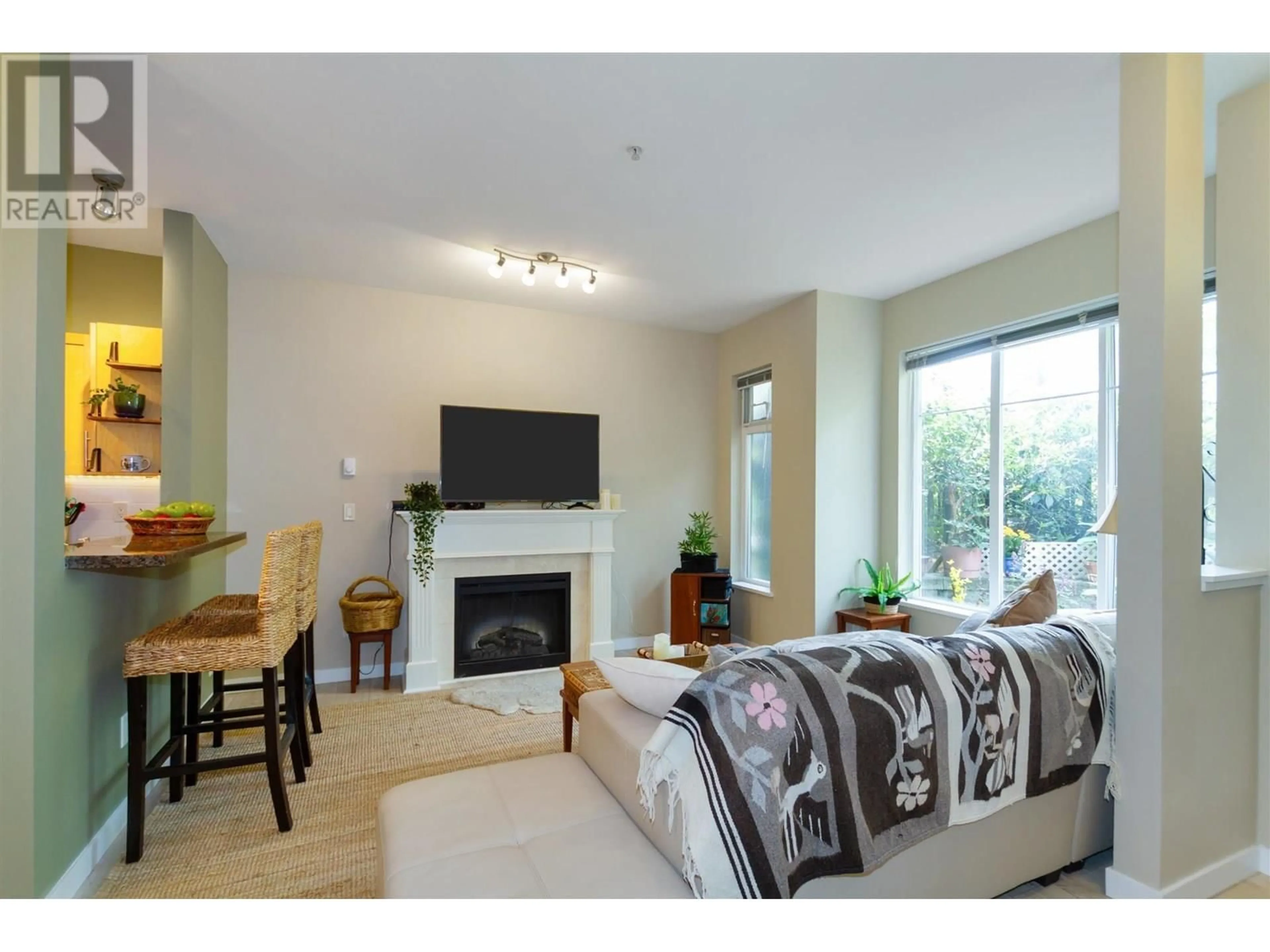 Living room with furniture, wood/laminate floor for 108 - 7000 21ST AVENUE, Burnaby British Columbia V5E4P1