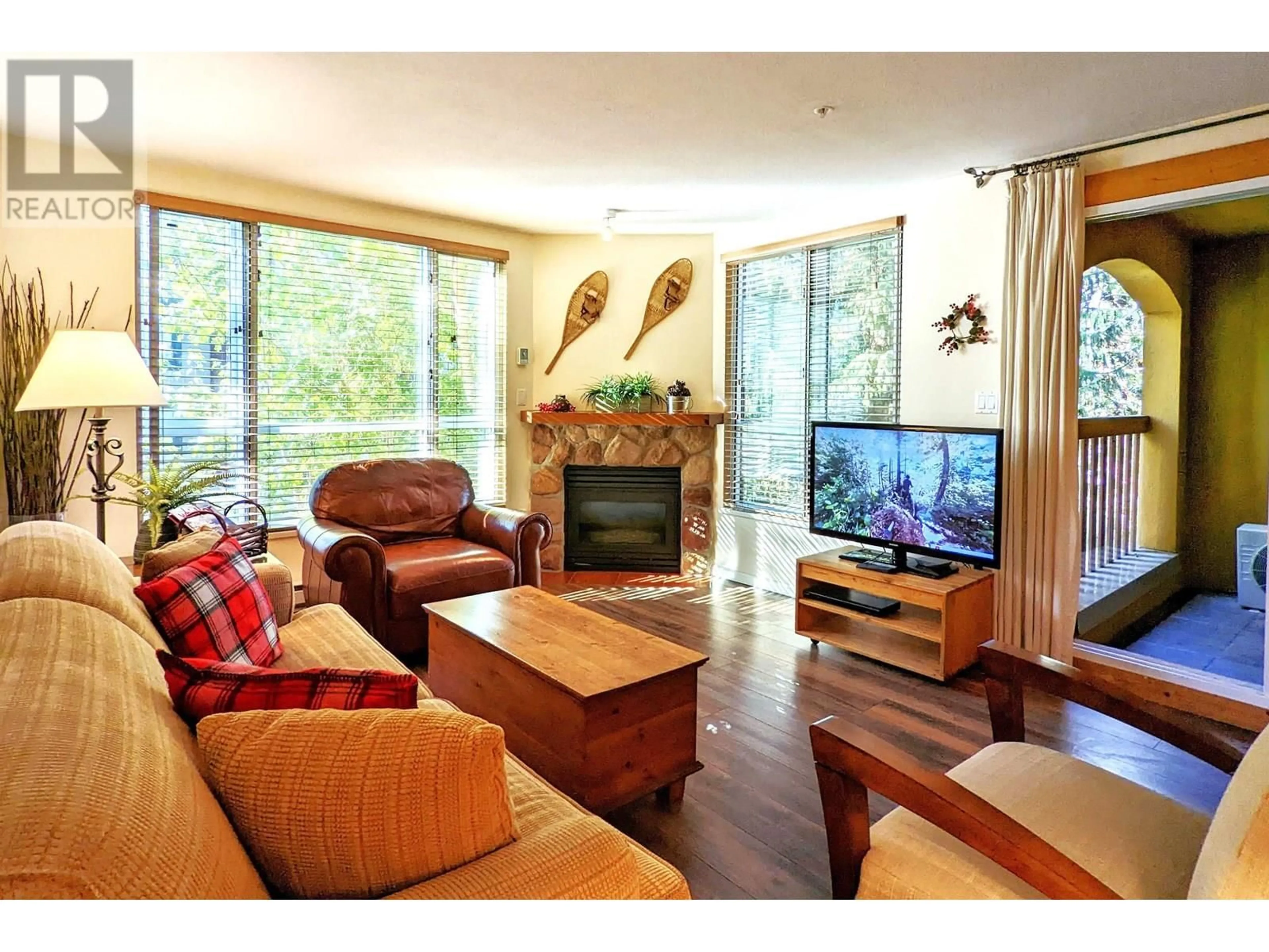 Living room with furniture, wood/laminate floor for 311 - 4314 MAIN STREET, Whistler British Columbia V8E1A8