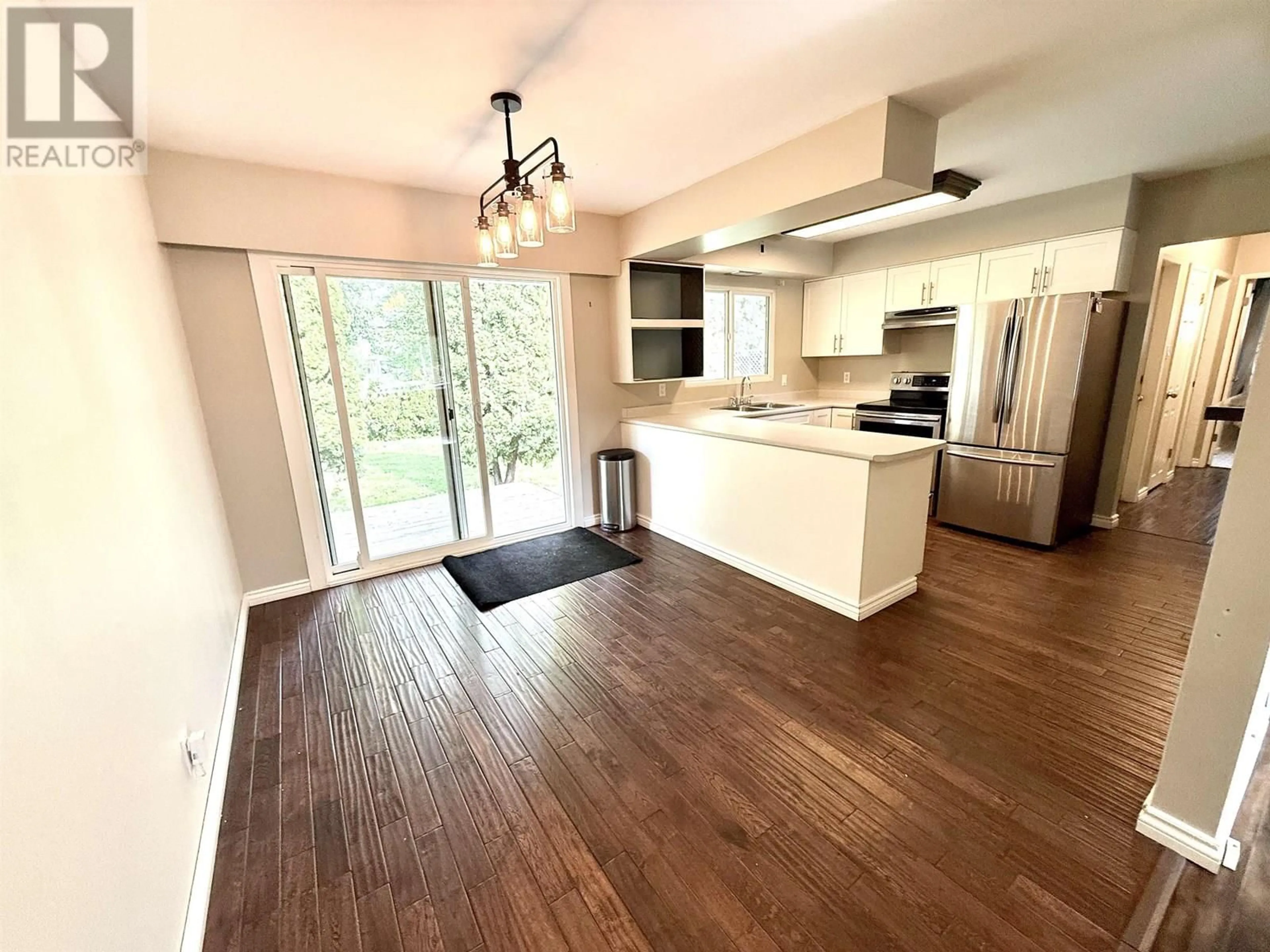 Open concept kitchen, wood/laminate floor for 156 DOUGLAS STREET, Prince George British Columbia V2M2L8