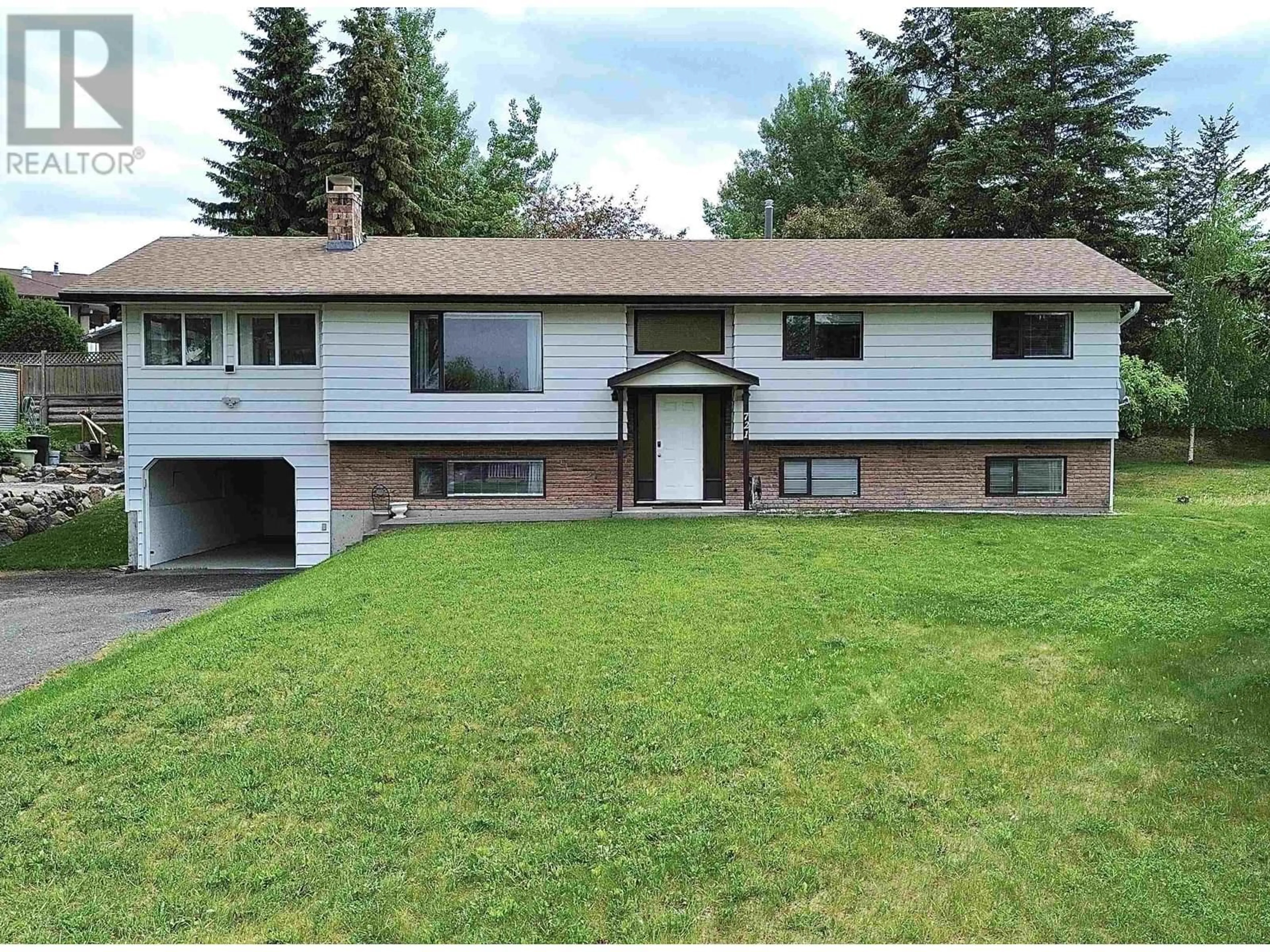 Home with vinyl exterior material, street for 721 CARIBOO TRAIL, 100 Mile House British Columbia V0K2E1