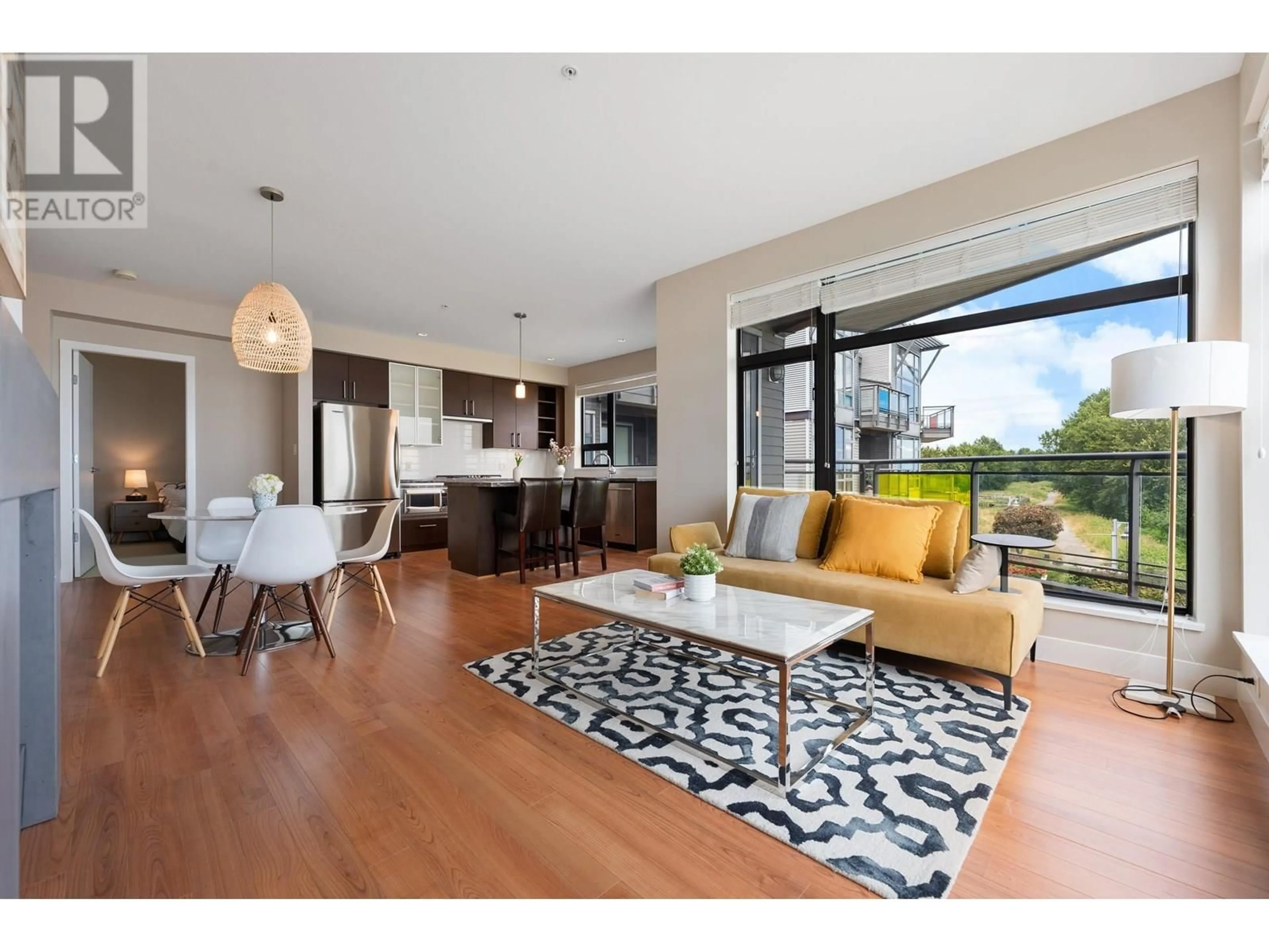 Living room with furniture, wood/laminate floor for 311 - 14300 RIVERPORT WAY, Richmond British Columbia V6W0A4