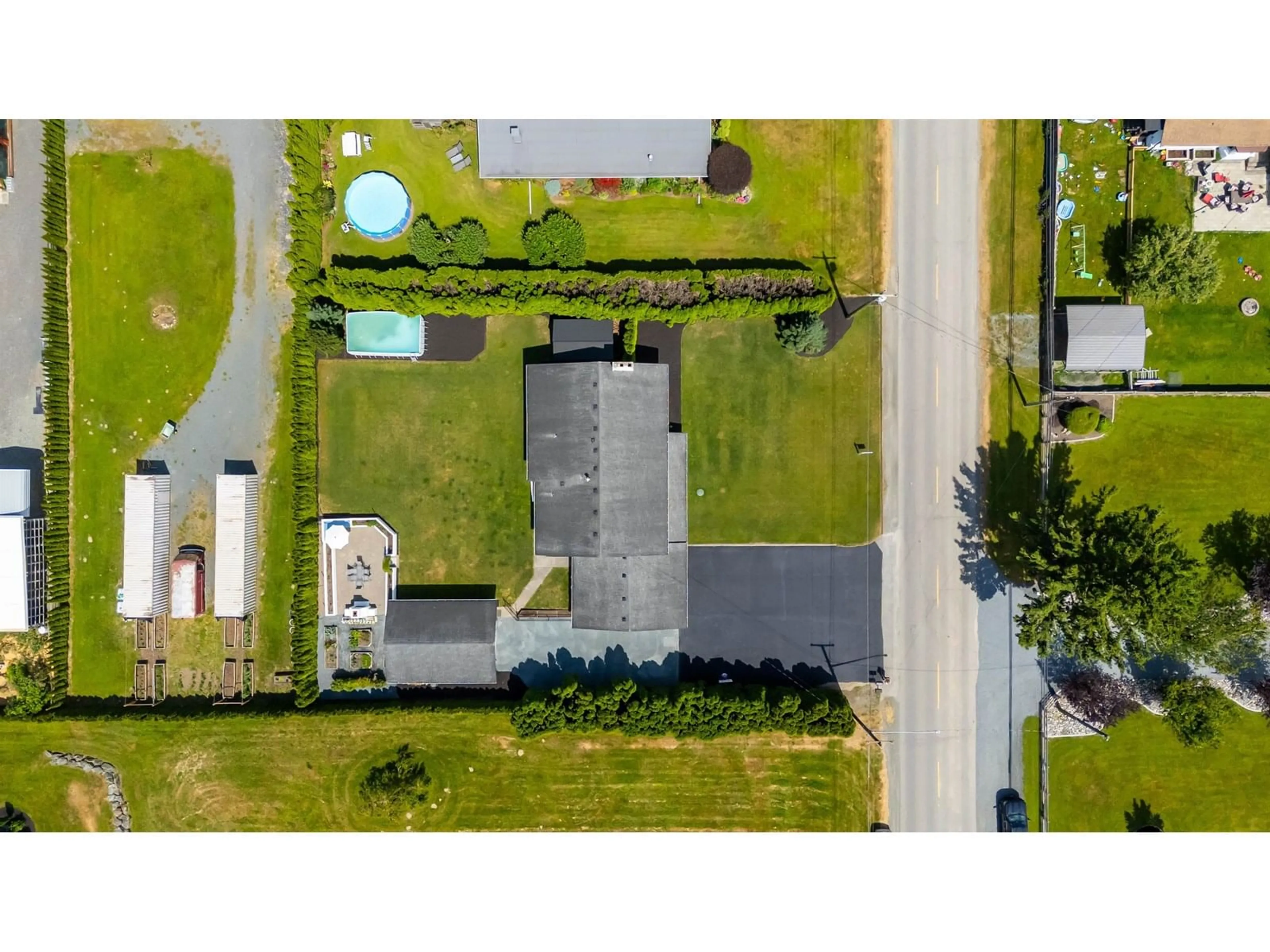 A pic from outside/outdoor area/front of a property/back of a property/a pic from drone, street for 6309 SUMAS PRAIRIE ROAD, Sardis - Greendale British Columbia V2R4N6