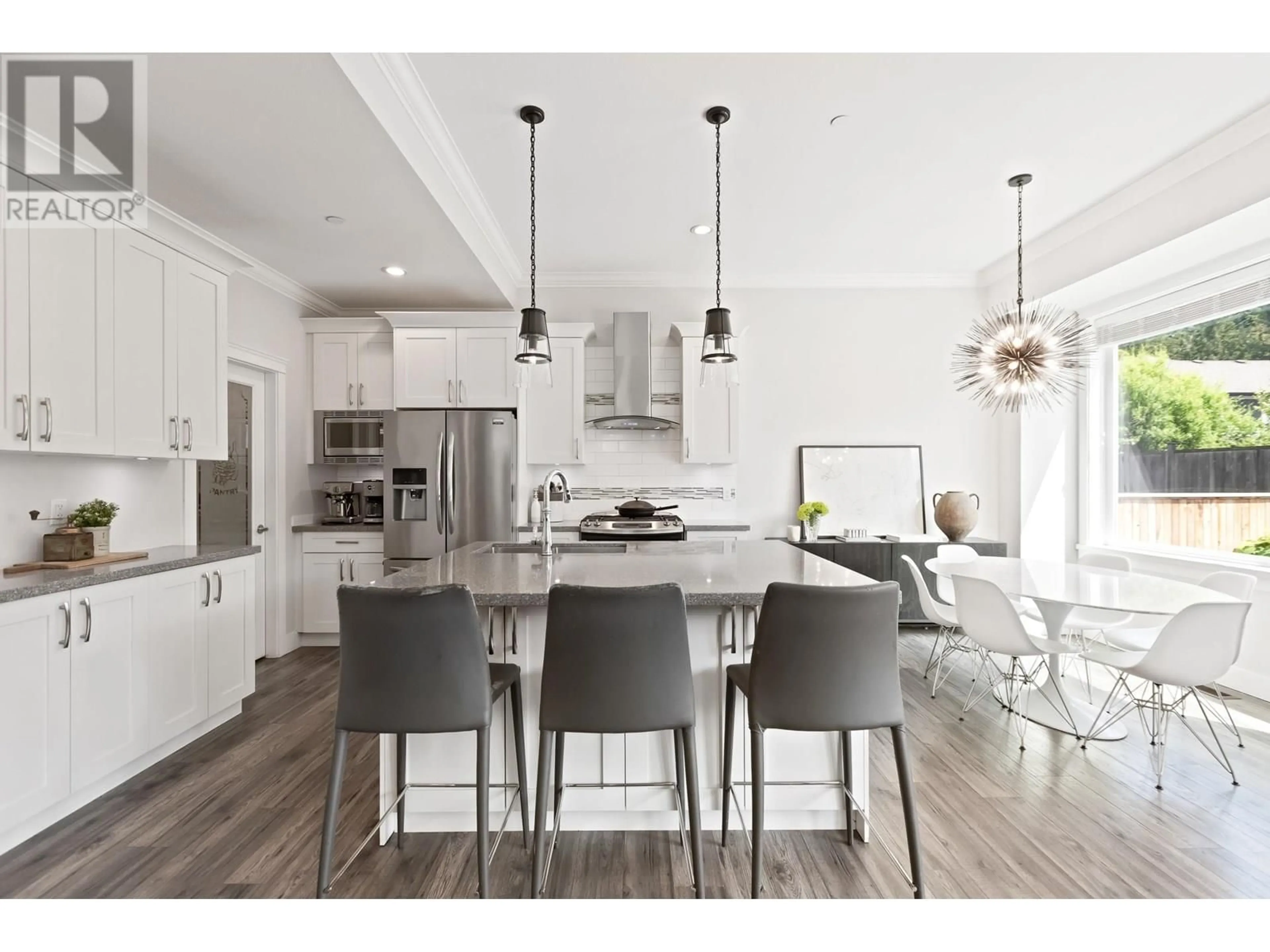 Open concept kitchen, wood/laminate floor for 10408 243 STREET, Maple Ridge British Columbia V2W0G7