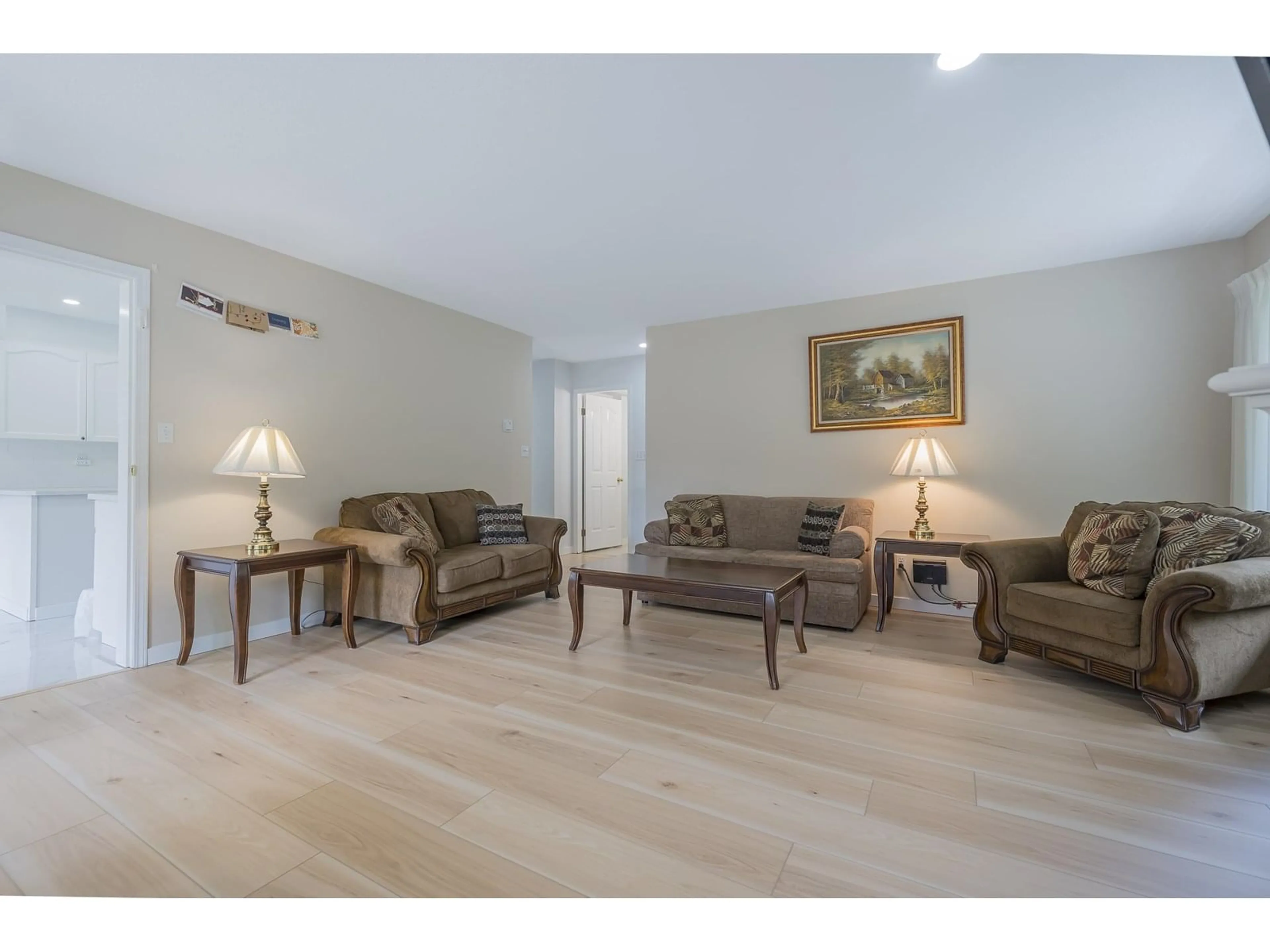 Living room with furniture, wood/laminate floor for 106 - 2491 GLADWIN, Abbotsford British Columbia V2T3N9