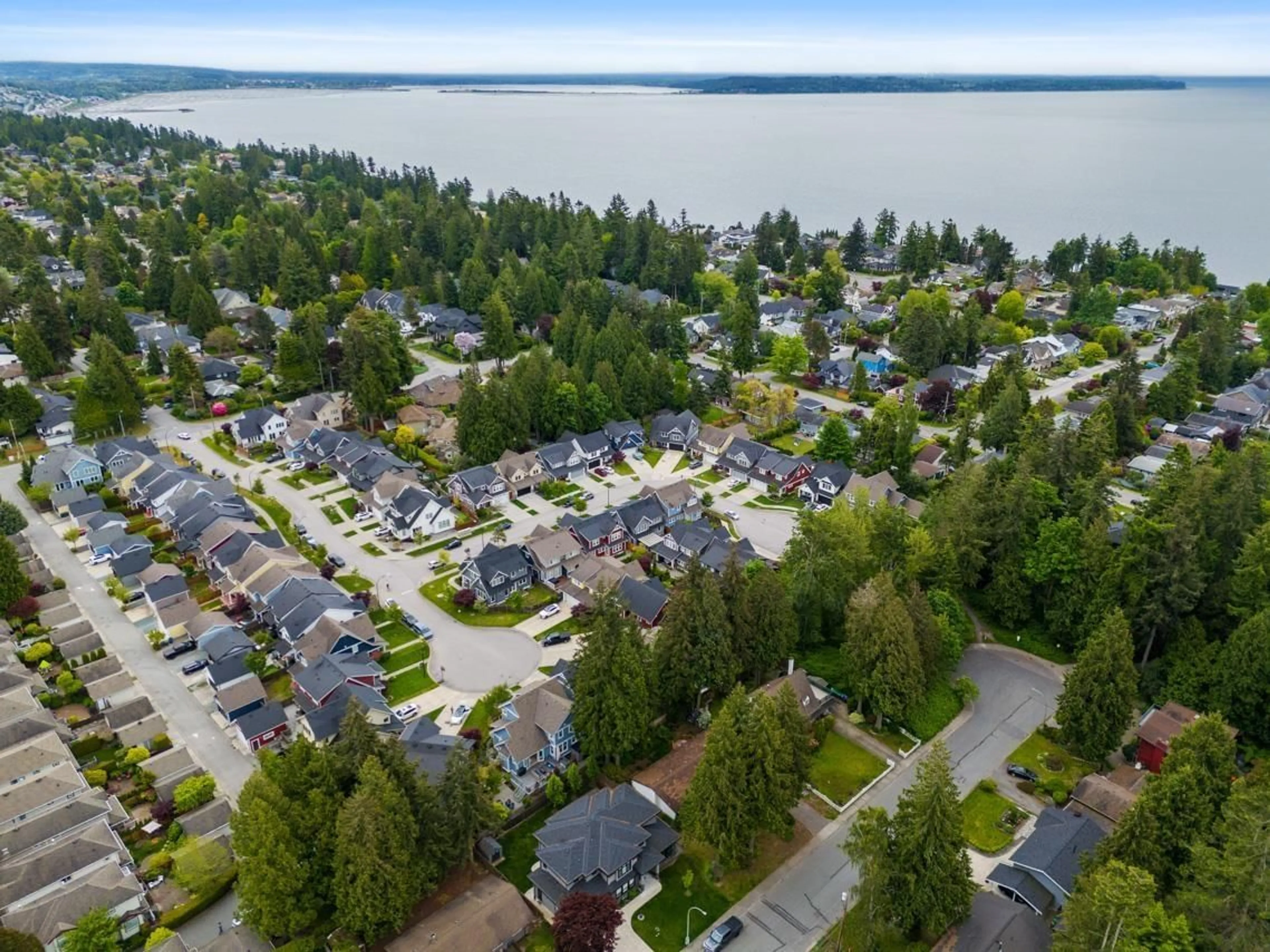 A pic from outside/outdoor area/front of a property/back of a property/a pic from drone, water/lake/river/ocean view for 12913 15A, Surrey British Columbia V4A0B7