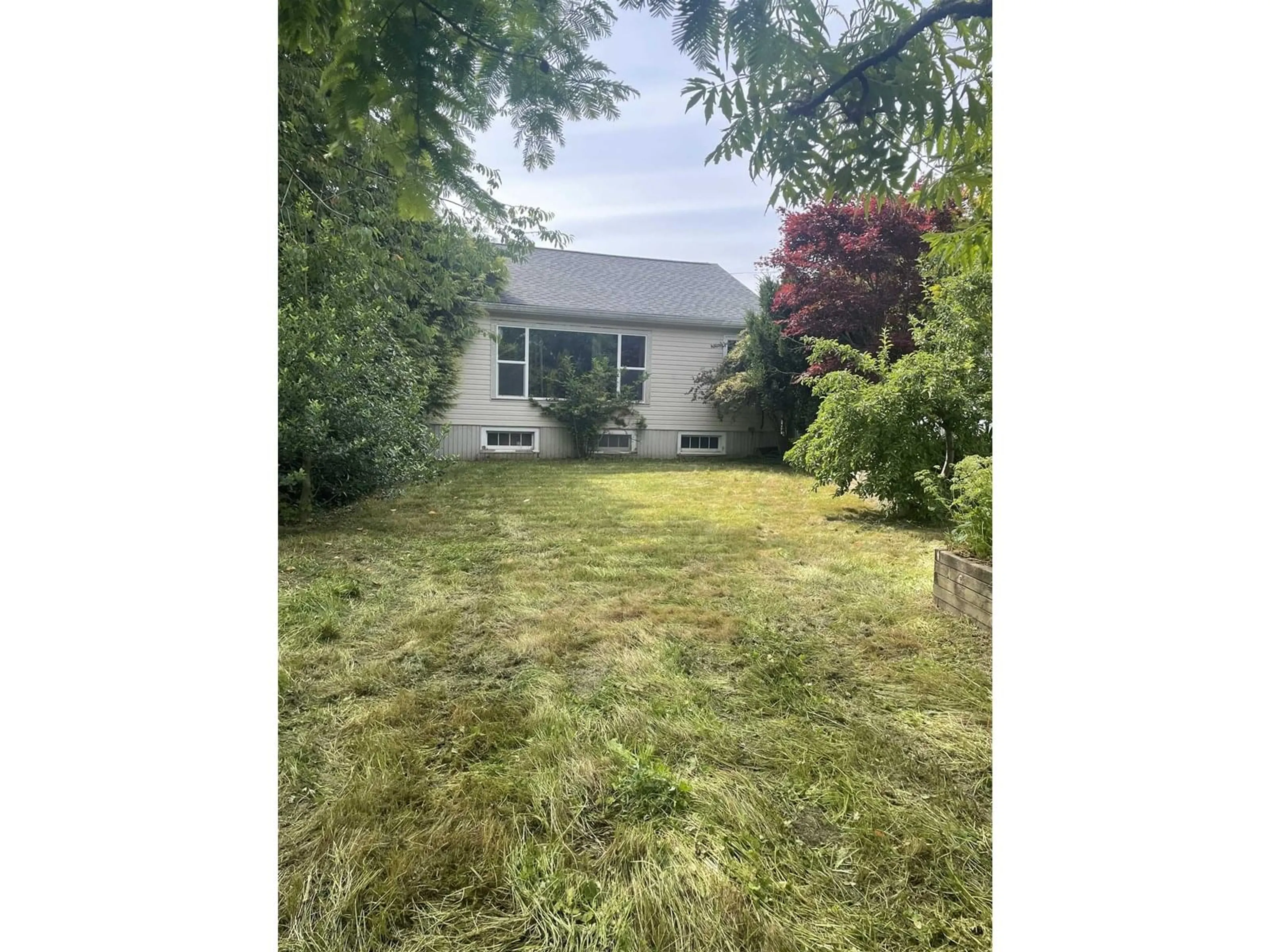 A pic from outside/outdoor area/front of a property/back of a property/a pic from drone, street for 9419 MCNAUGHT ROAD, Chilliwack British Columbia V2P6E7