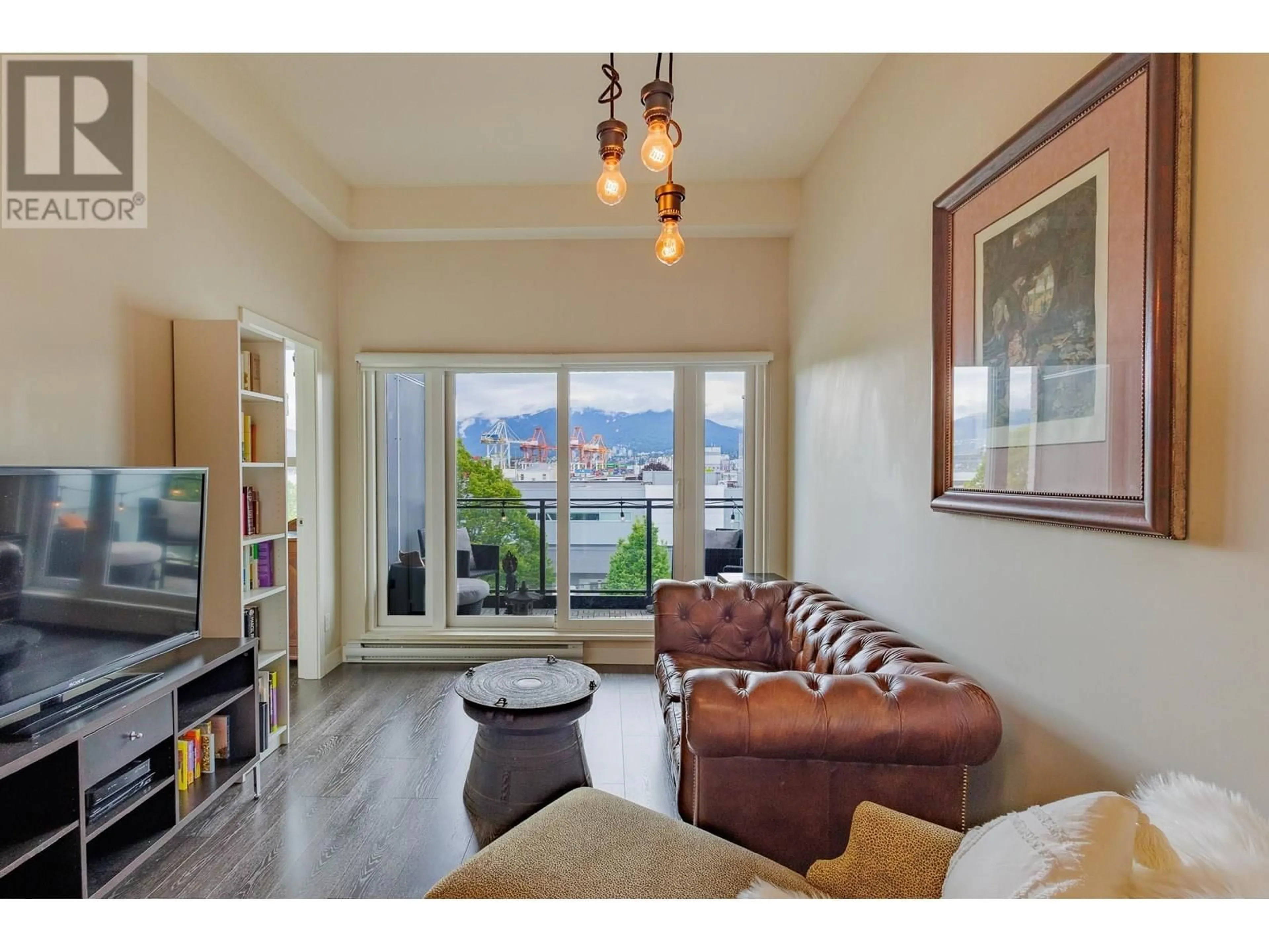 Living room with furniture, wood/laminate floor for 421 - 1588 HASTINGS STREET, Vancouver British Columbia V5L0B8