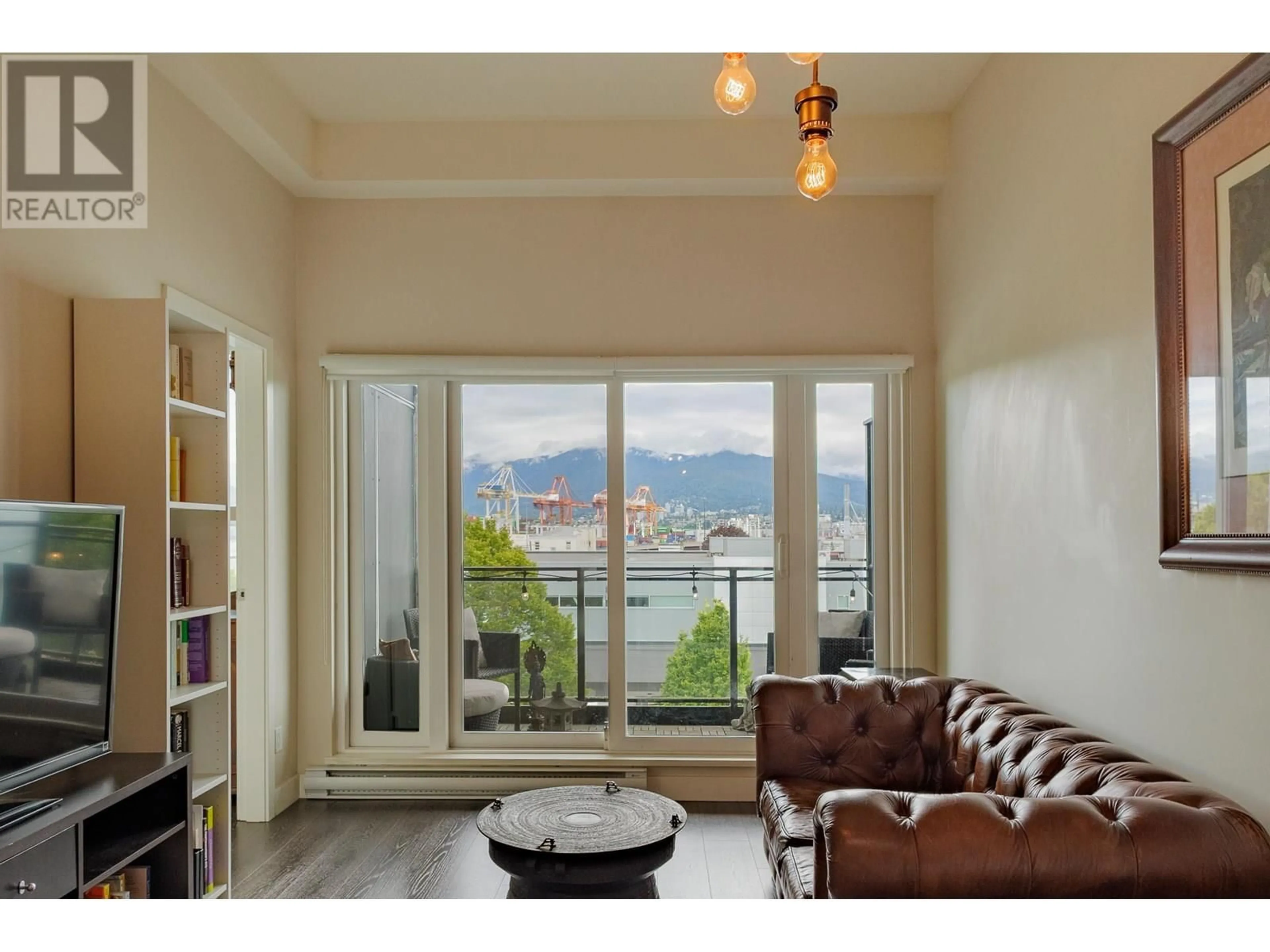 Living room with furniture, wood/laminate floor for 421 - 1588 HASTINGS STREET, Vancouver British Columbia V5L0B8