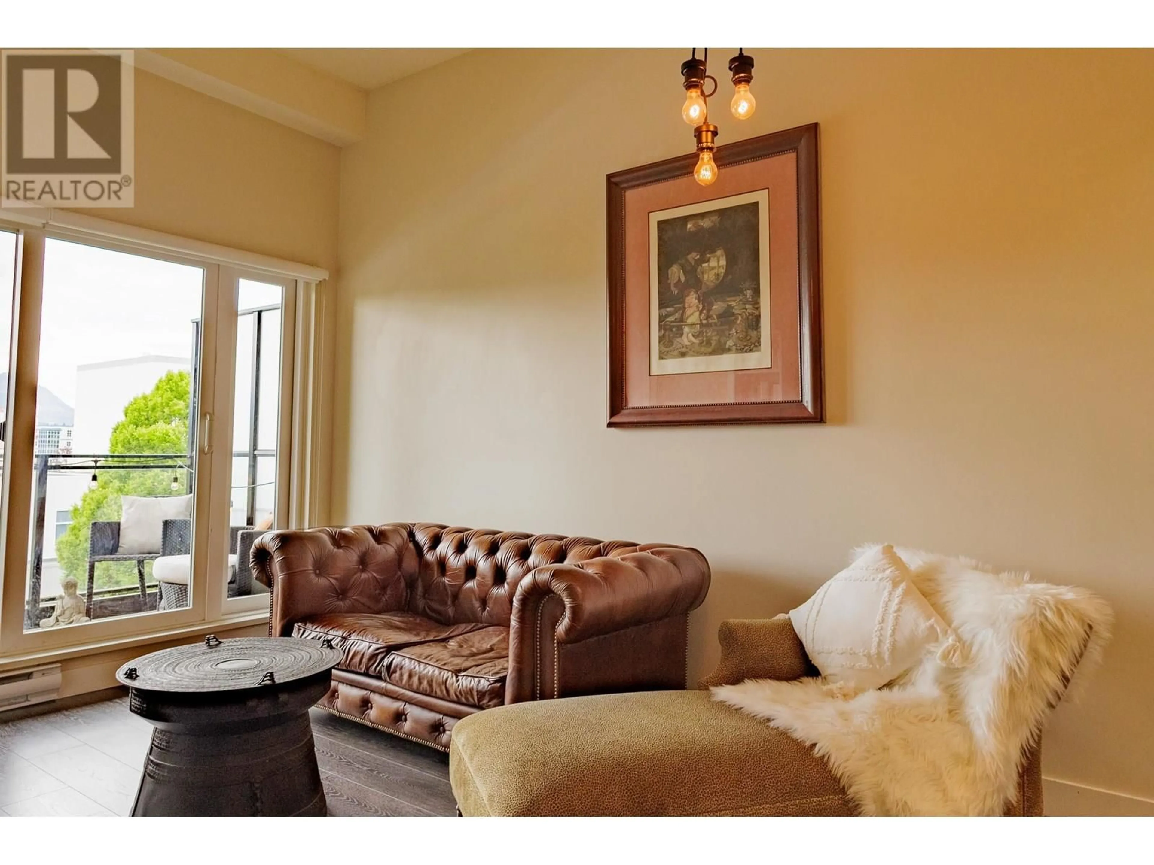 Living room with furniture, wood/laminate floor for 421 - 1588 HASTINGS STREET, Vancouver British Columbia V5L0B8