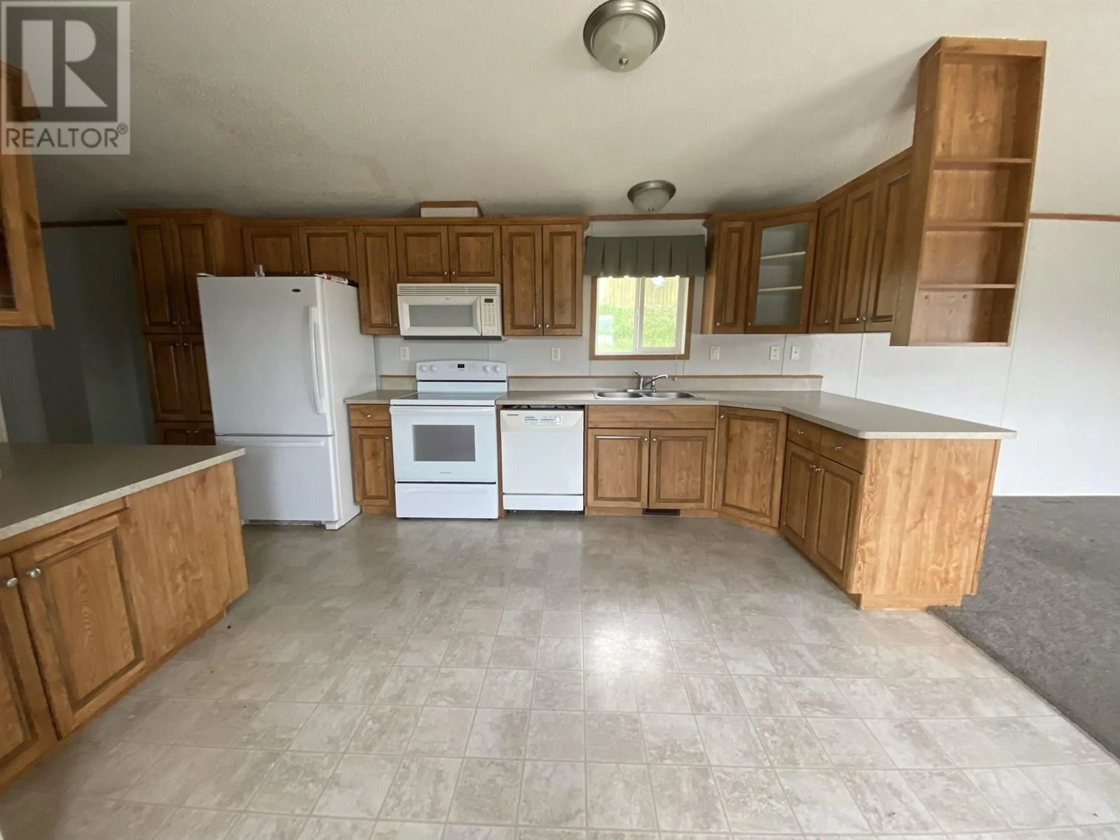 Standard kitchen, ceramic/tile floor for 10704 LEARMONTH STREET, Hudsons Hope British Columbia V0C1V0