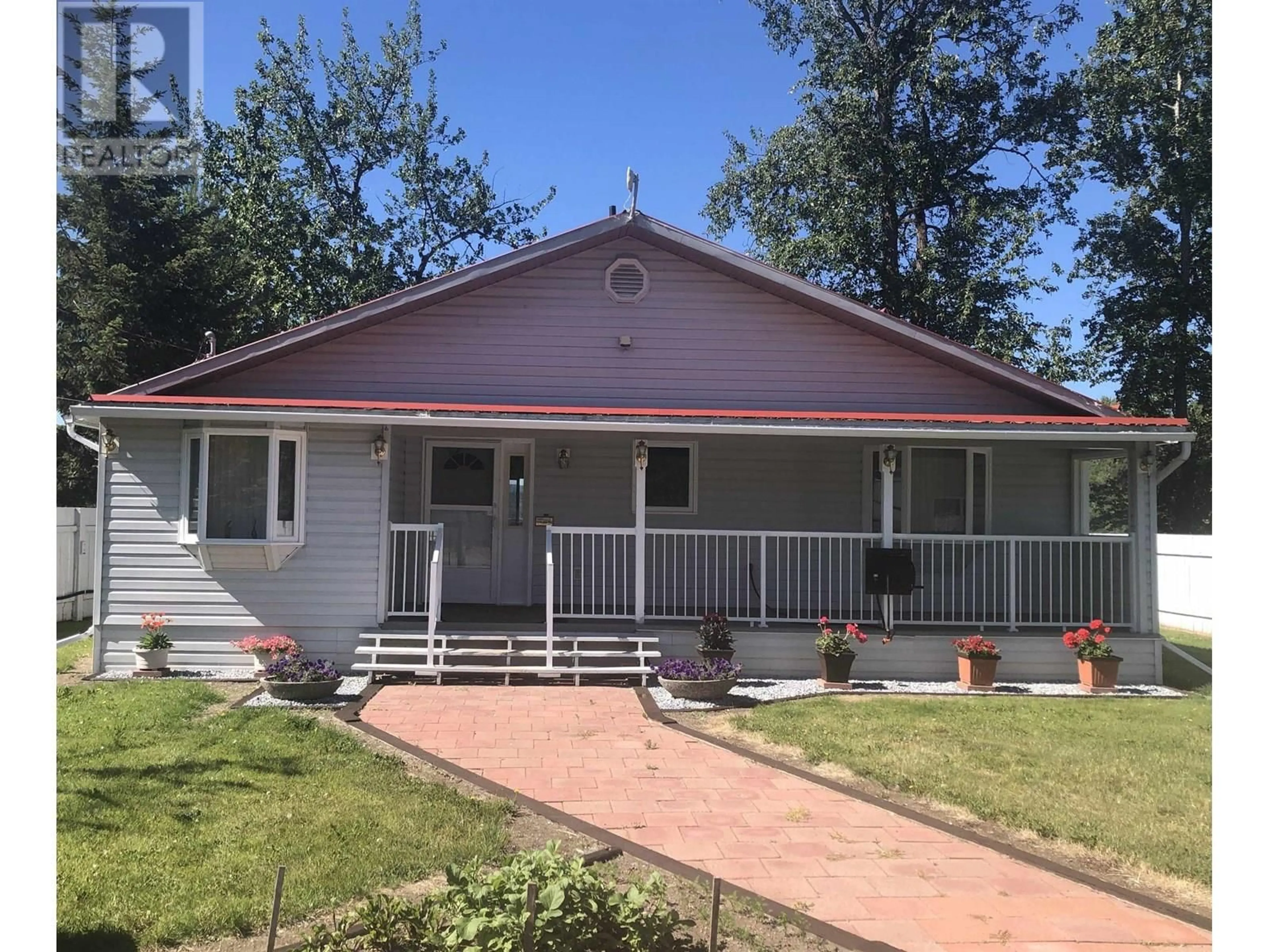 Home with vinyl exterior material, street for 7013 PETERSON ROAD, Fraser Lake British Columbia V0J1S0