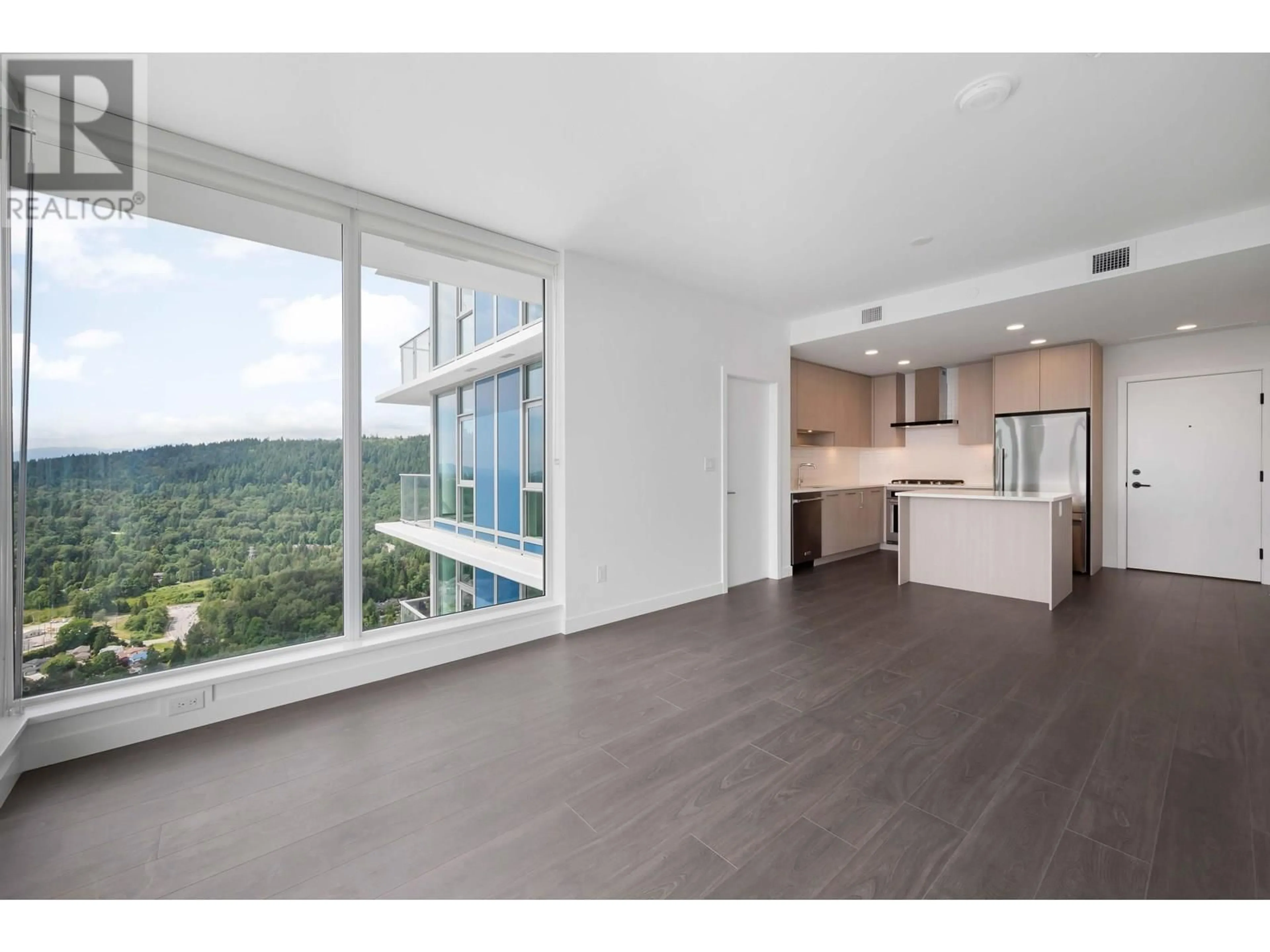 Open concept kitchen, wood/laminate floor for 4307 - 518 CLARKE ROAD, Coquitlam British Columbia V3J3X2