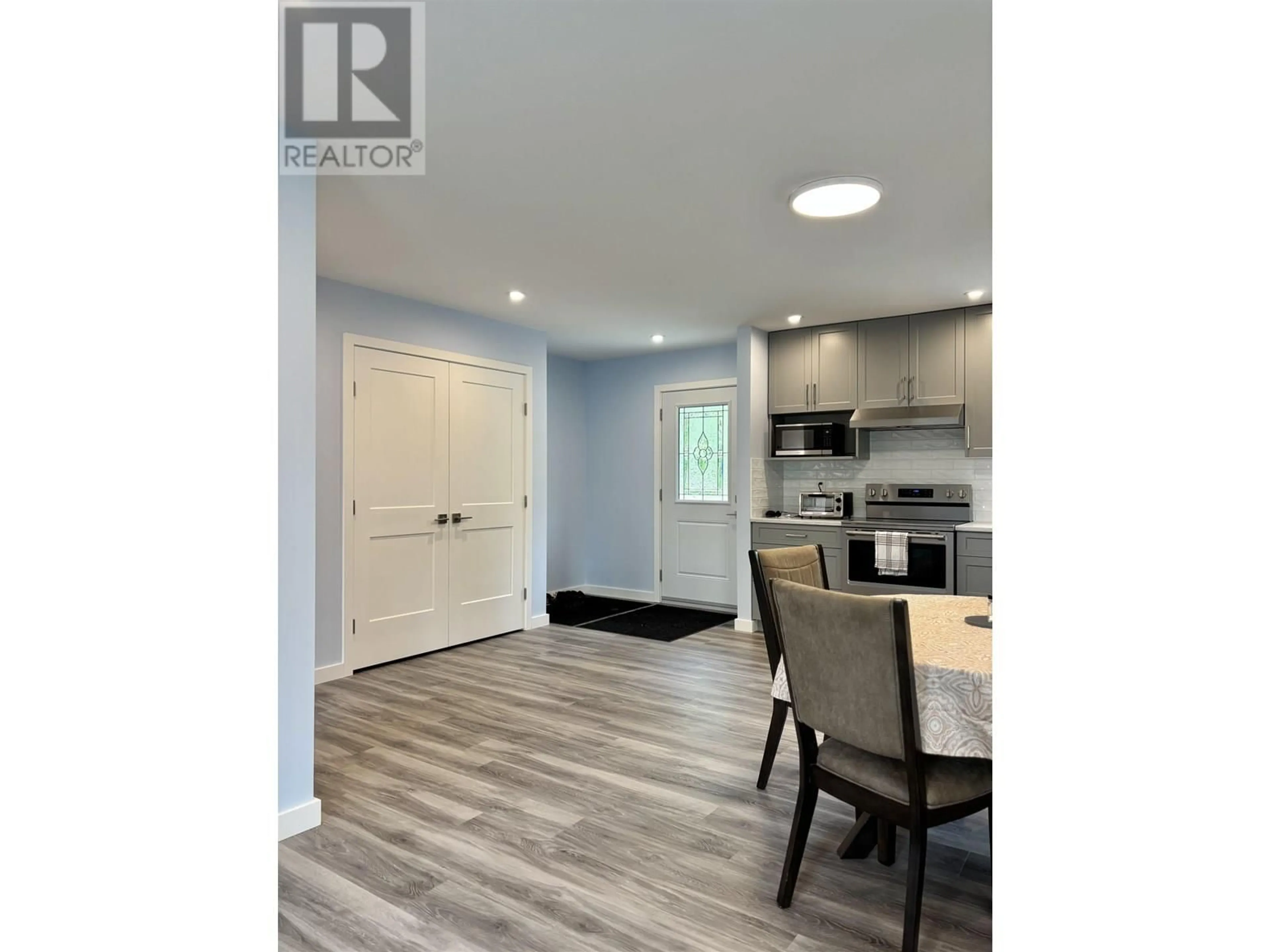 Open concept kitchen, wood/laminate floor for 3050 GLEASON CRESCENT, Williams Lake British Columbia V0L1G0