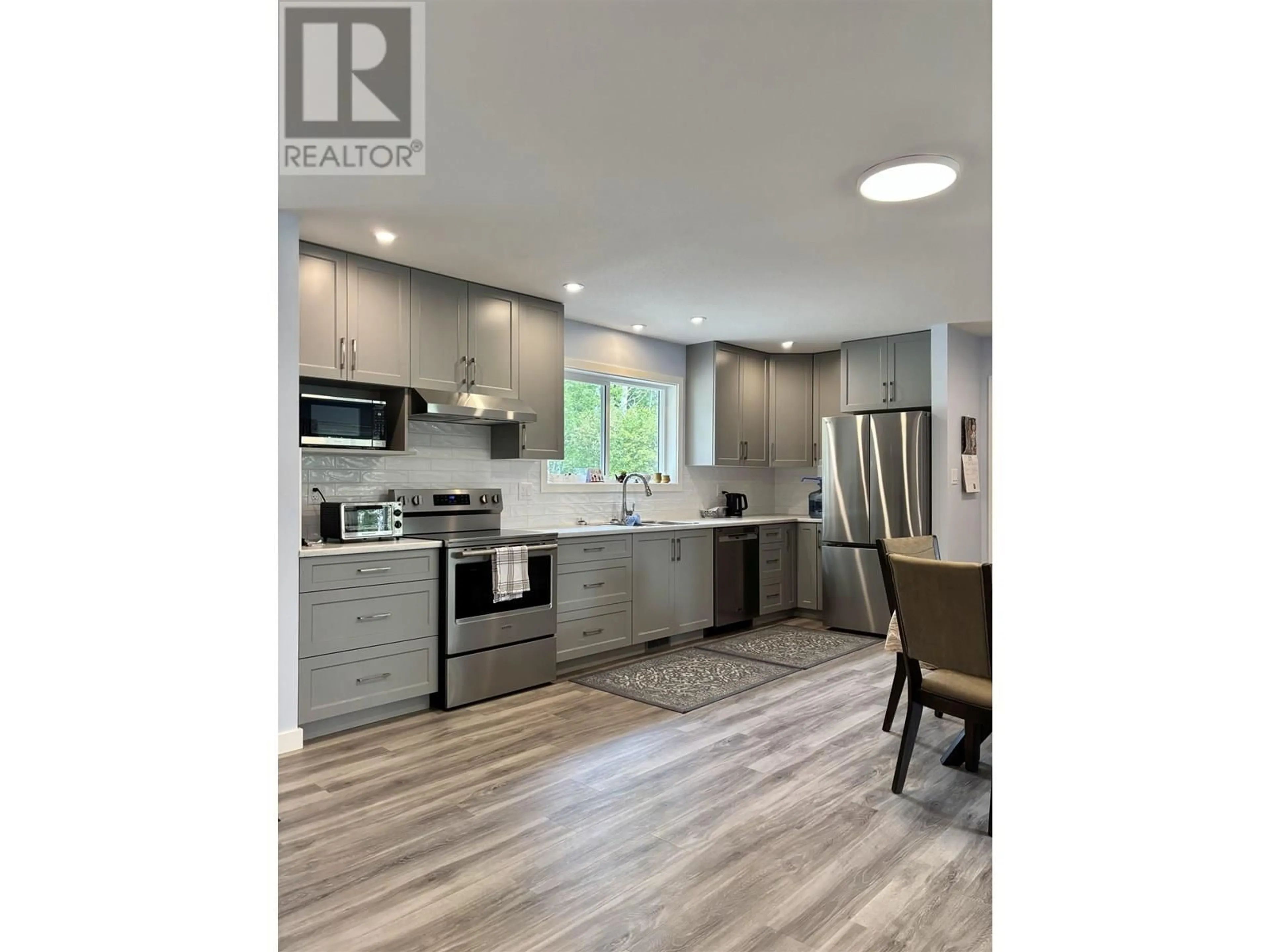 Open concept kitchen, wood/laminate floor for 3050 GLEASON CRESCENT, Williams Lake British Columbia V0L1G0
