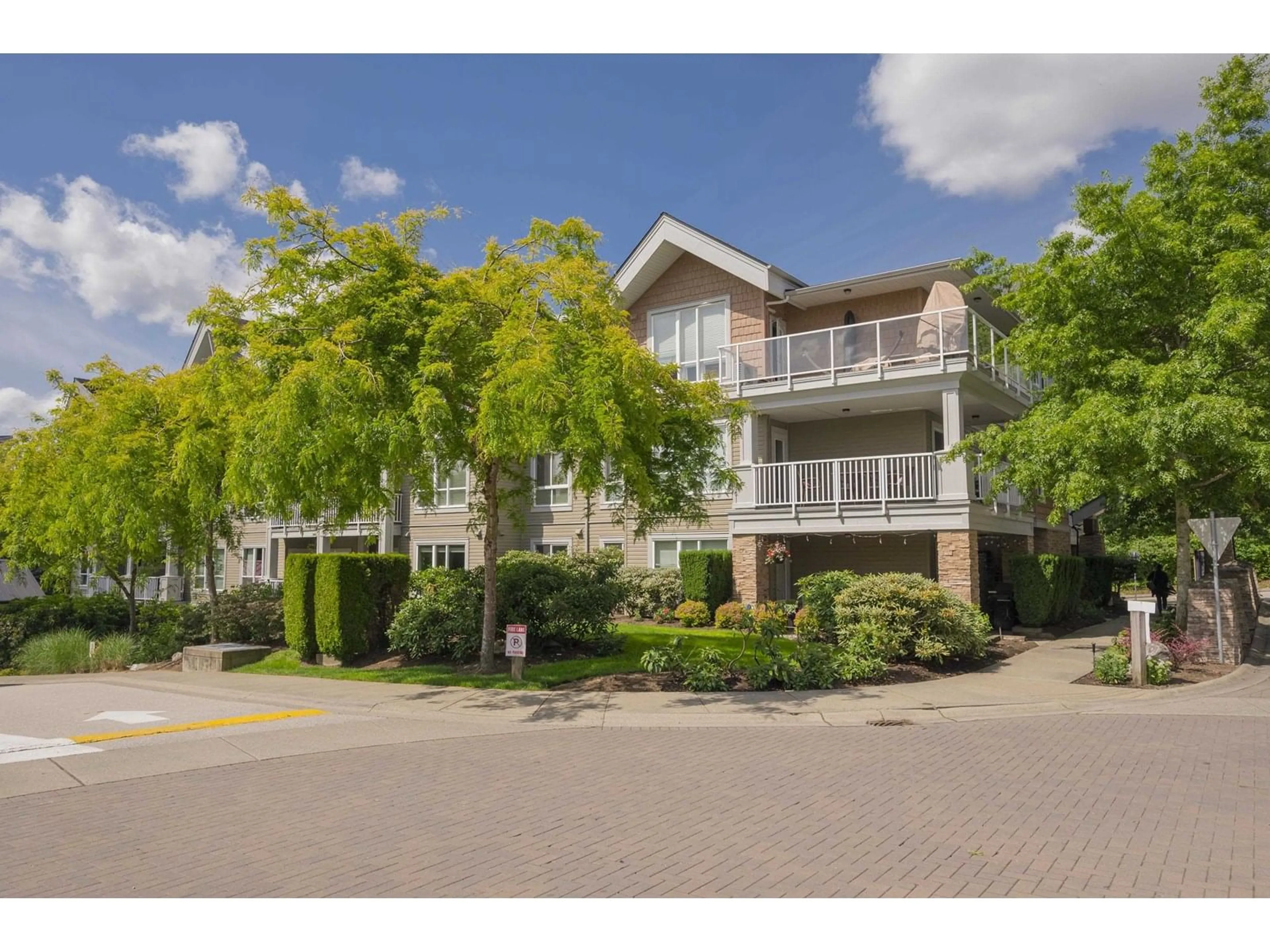 A pic from outside/outdoor area/front of a property/back of a property/a pic from drone, street for 409 - 6420 194, Surrey British Columbia V4N6J7