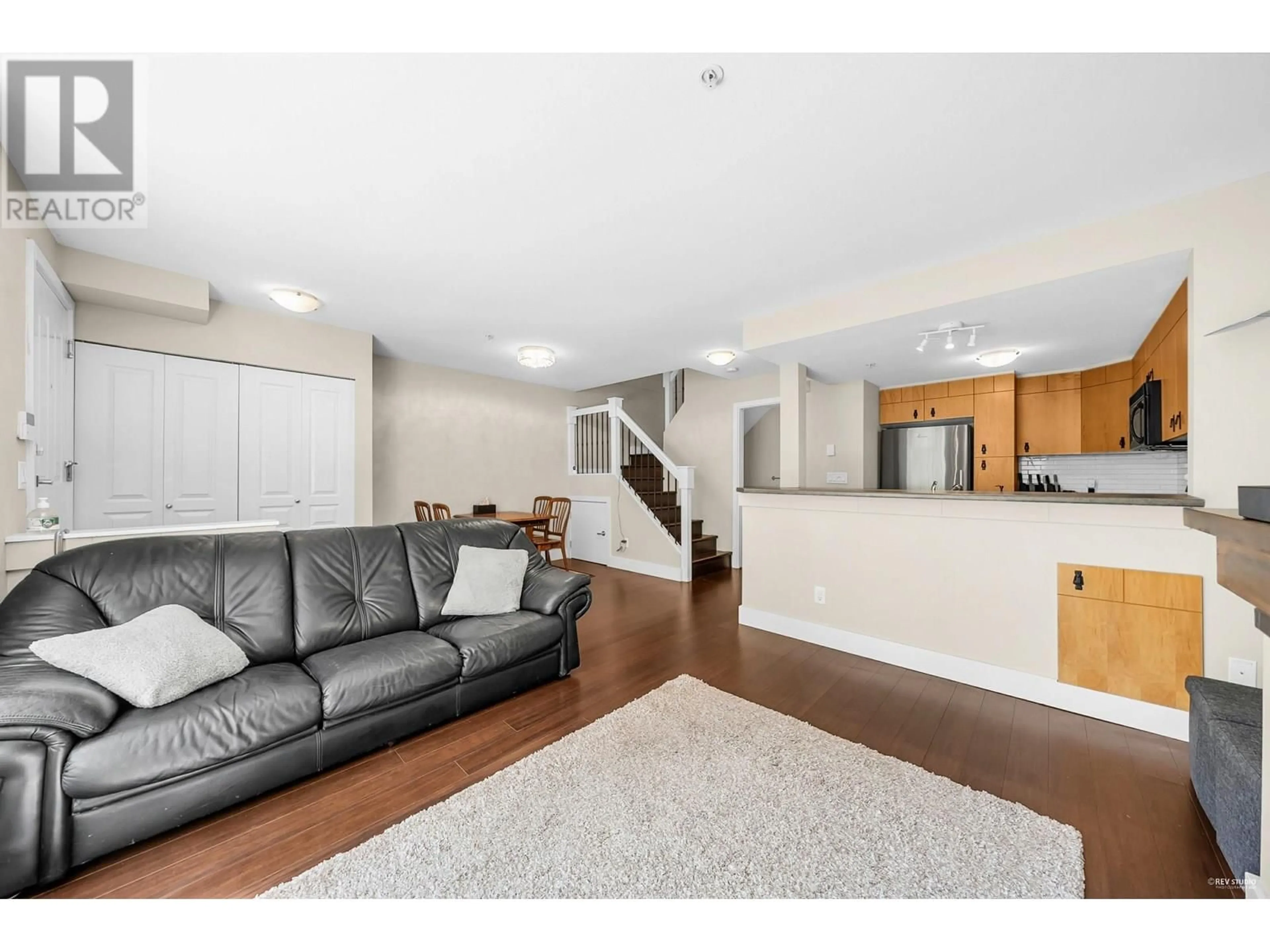 Living room with furniture, wood/laminate floor for 28 - 7428 SOUTHWYNDE AVENUE, Burnaby British Columbia V3N0A1