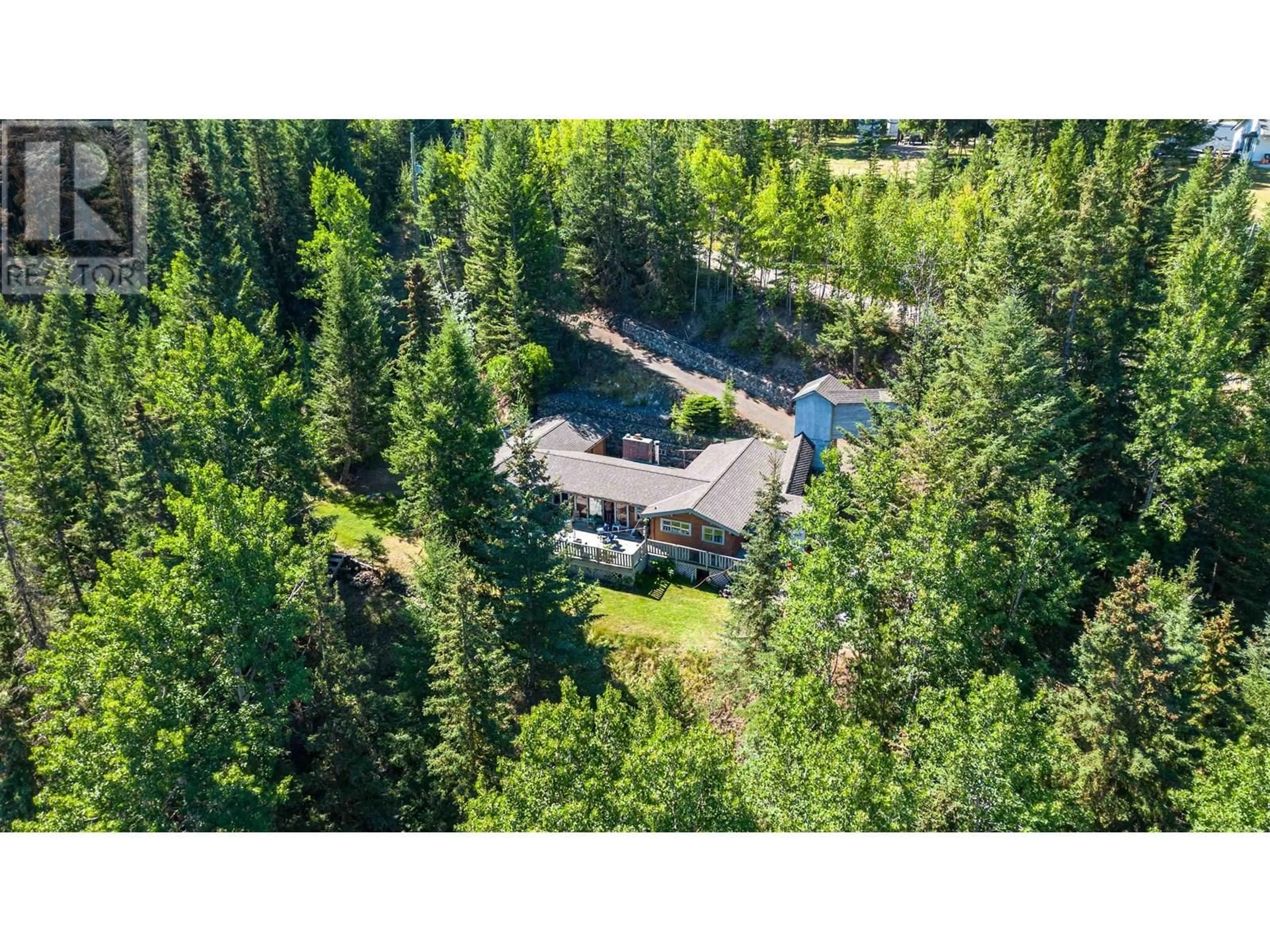 A pic from outside/outdoor area/front of a property/back of a property/a pic from drone, forest/trees view for 6088 NORMAN ROAD, 100 Mile House British Columbia V0K2E3