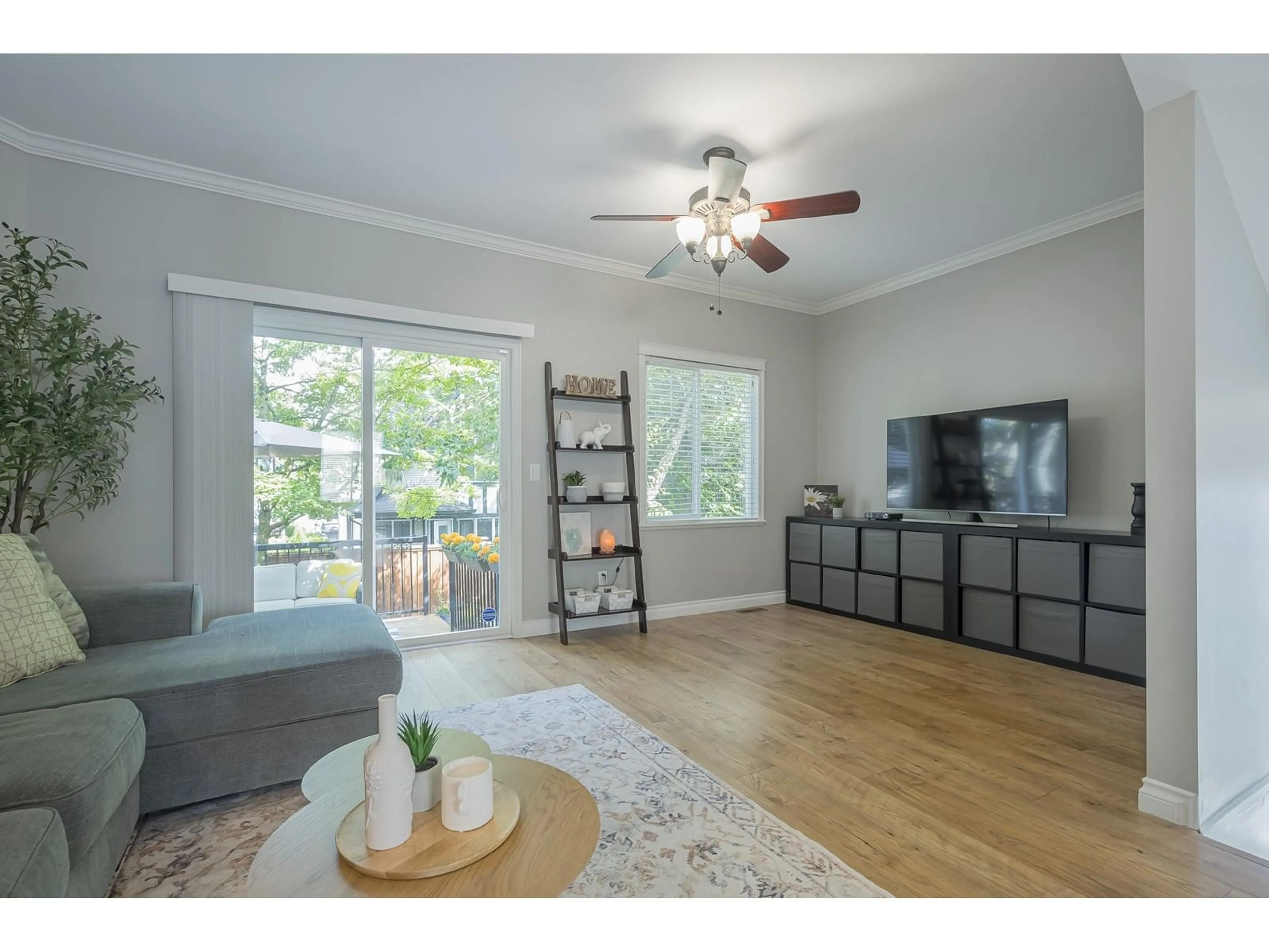 Living room with furniture, wood/laminate floor for 23 - 6588 188, Surrey British Columbia V3S1Z6
