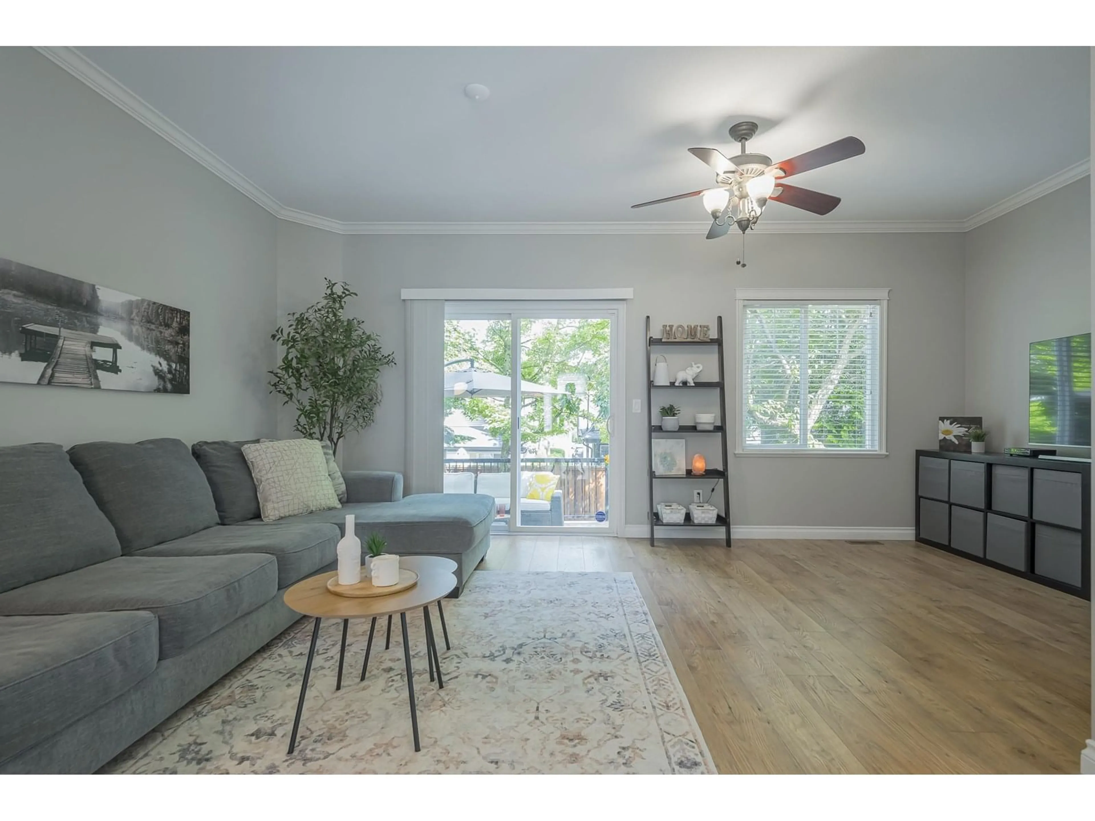 Living room with furniture, wood/laminate floor for 23 - 6588 188, Surrey British Columbia V3S1Z6