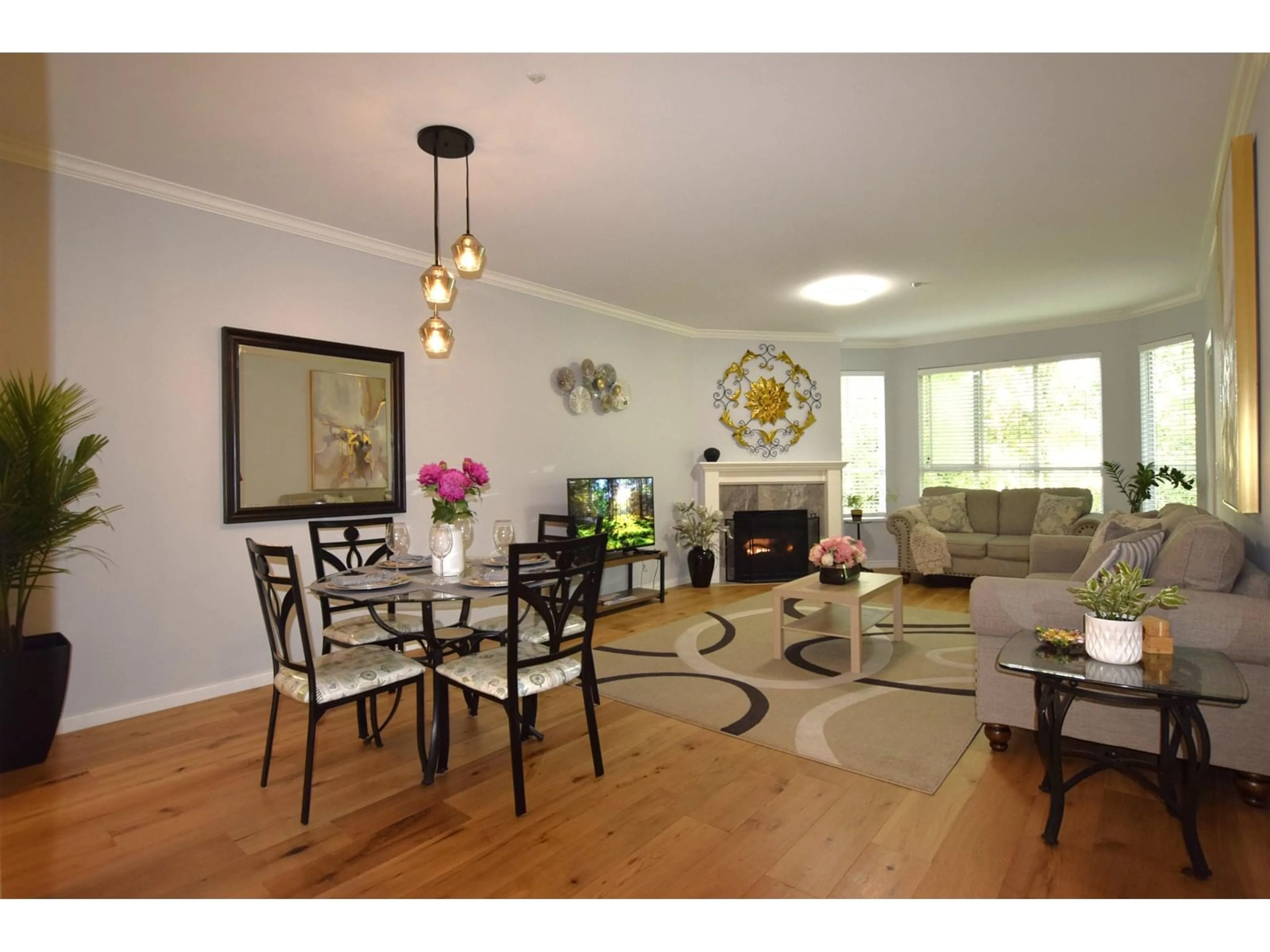 Living room with furniture, wood/laminate floor for 304 - 5646 200, Langley British Columbia V3A1M8