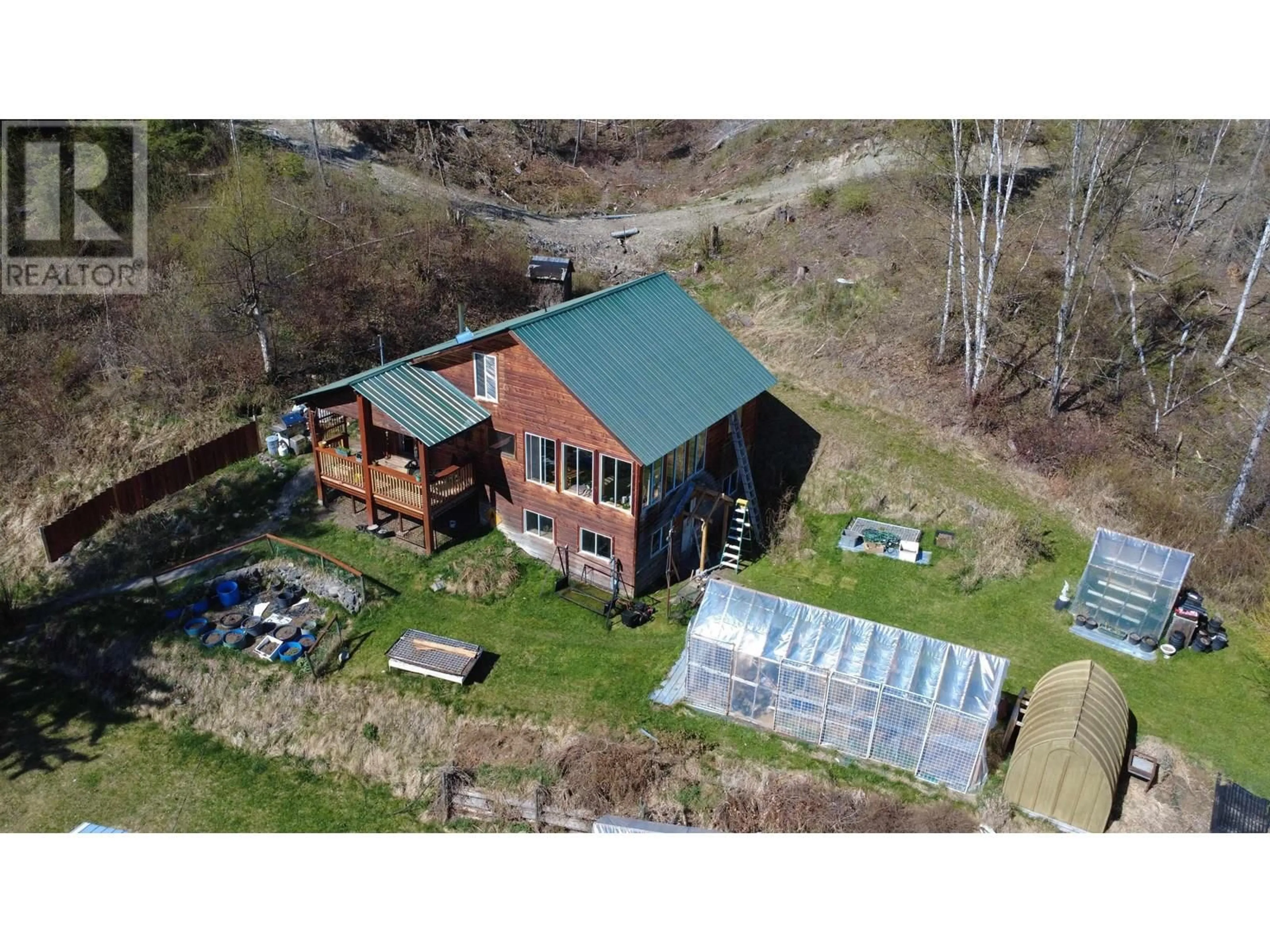 A pic from outside/outdoor area/front of a property/back of a property/a pic from drone, building for 4014 CANIM-HENDRIX LAKE ROAD, Canim Lake British Columbia V0K1J0