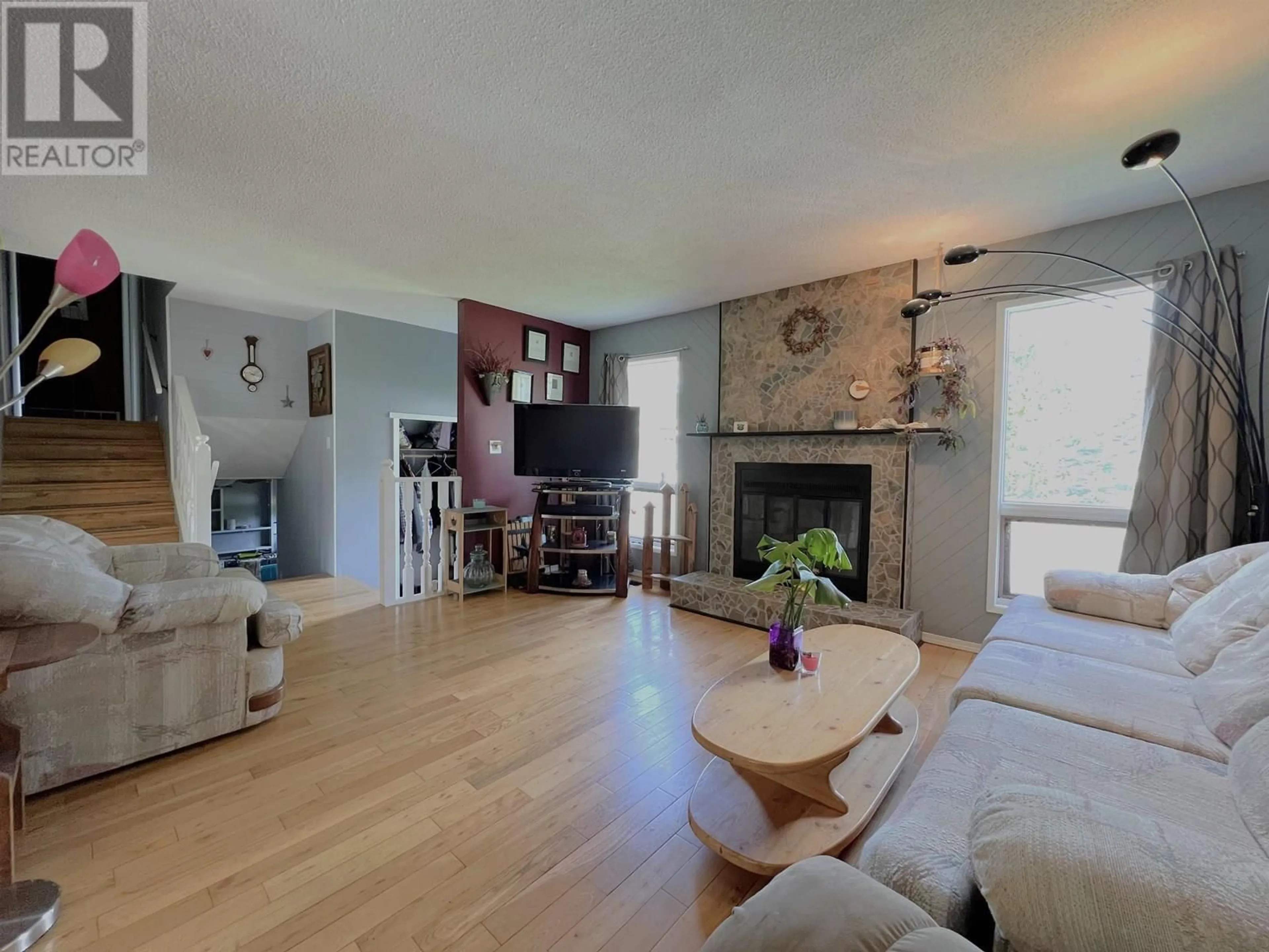 Living room with furniture, wood/laminate floor for 8145 ST LAWRENCE AVENUE, Prince George British Columbia V2N4K6