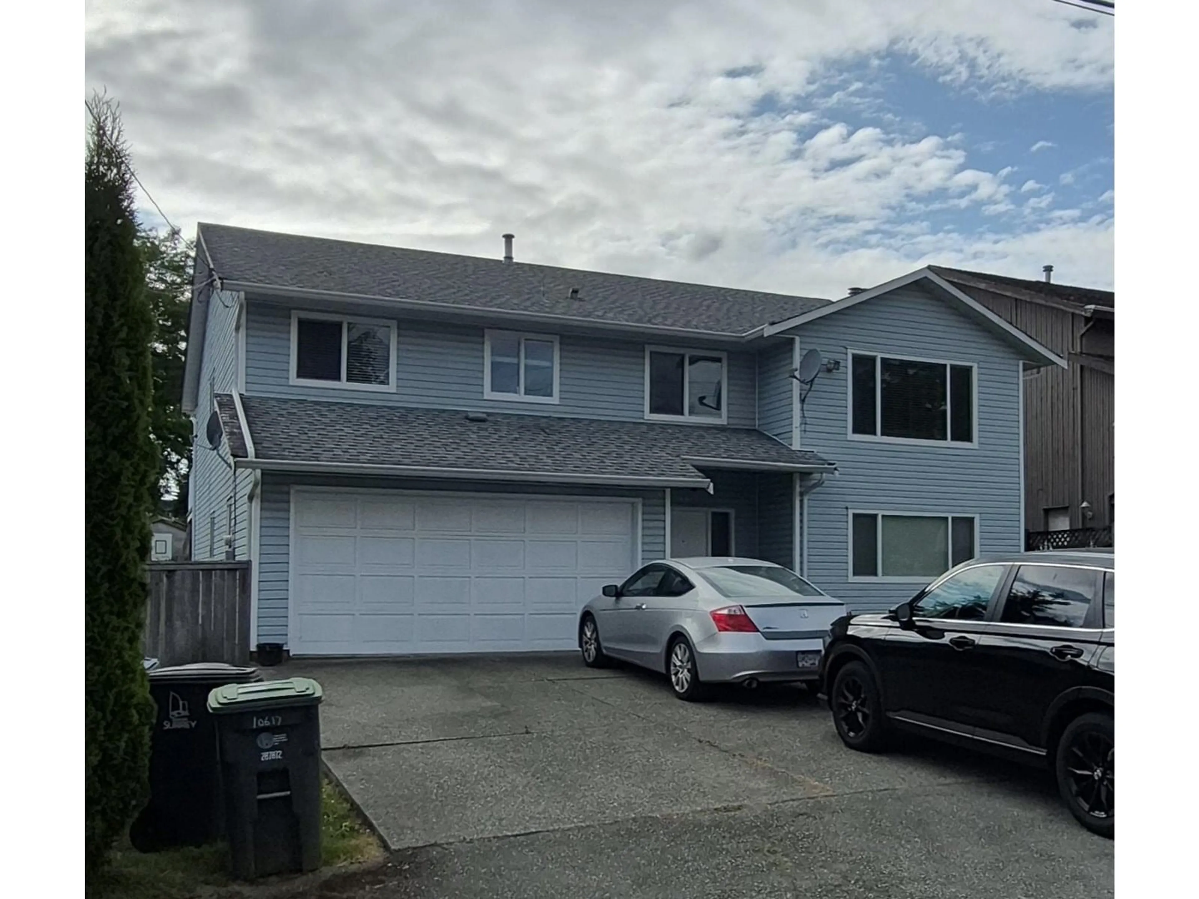 Home with vinyl exterior material, street for 10617 138A, Surrey British Columbia V3T4L2
