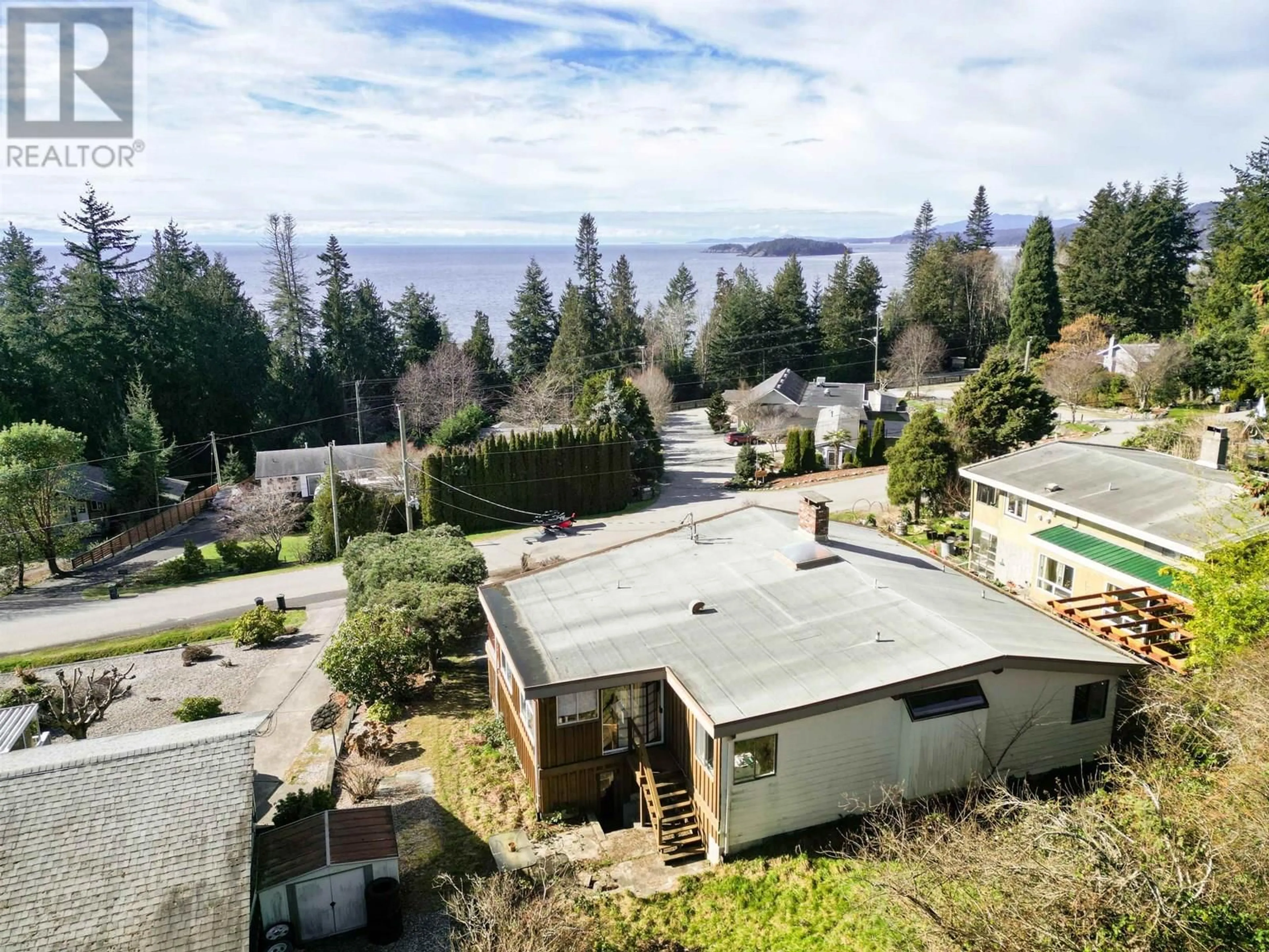 A pic from outside/outdoor area/front of a property/back of a property/a pic from drone, water/lake/river/ocean view for 4934 GEER ROAD, Sechelt British Columbia V0N3A2