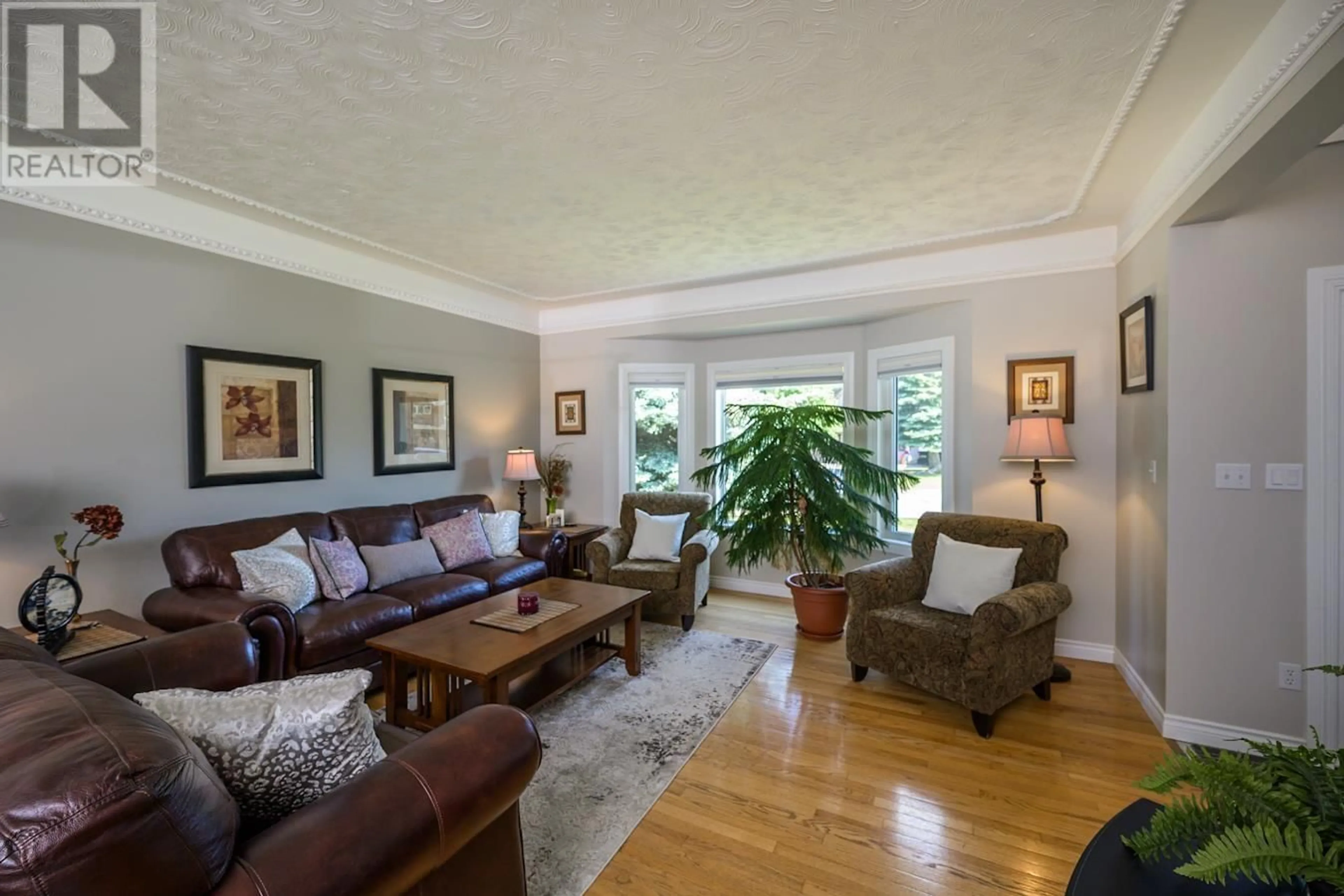 Living room with furniture, wood/laminate floor for 2665 CARLISLE WAY, Prince George British Columbia V2K4B5