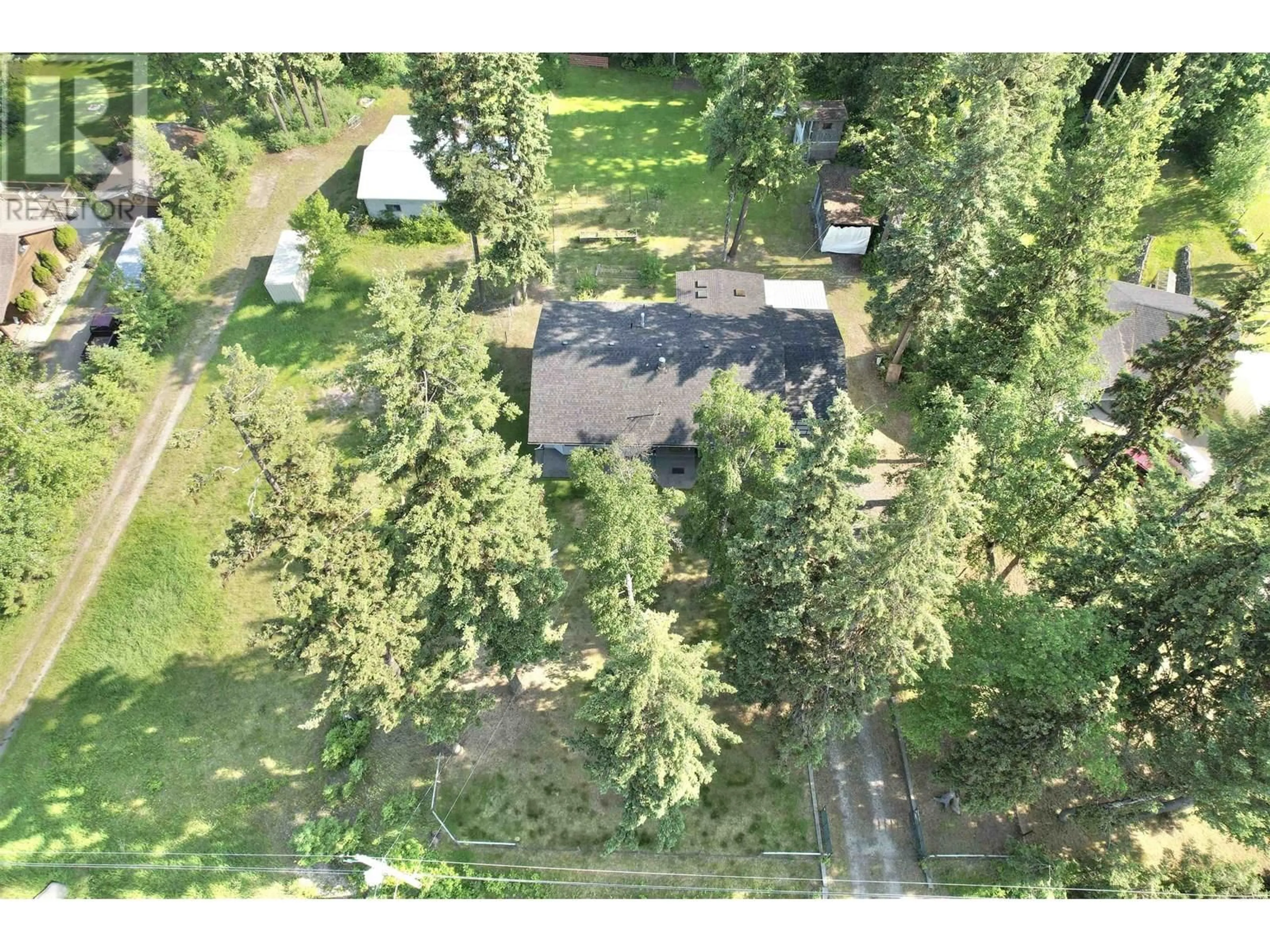 A pic from outside/outdoor area/front of a property/back of a property/a pic from drone, forest/trees view for 2401 TANOKA ROAD, Quesnel British Columbia V2J7B8