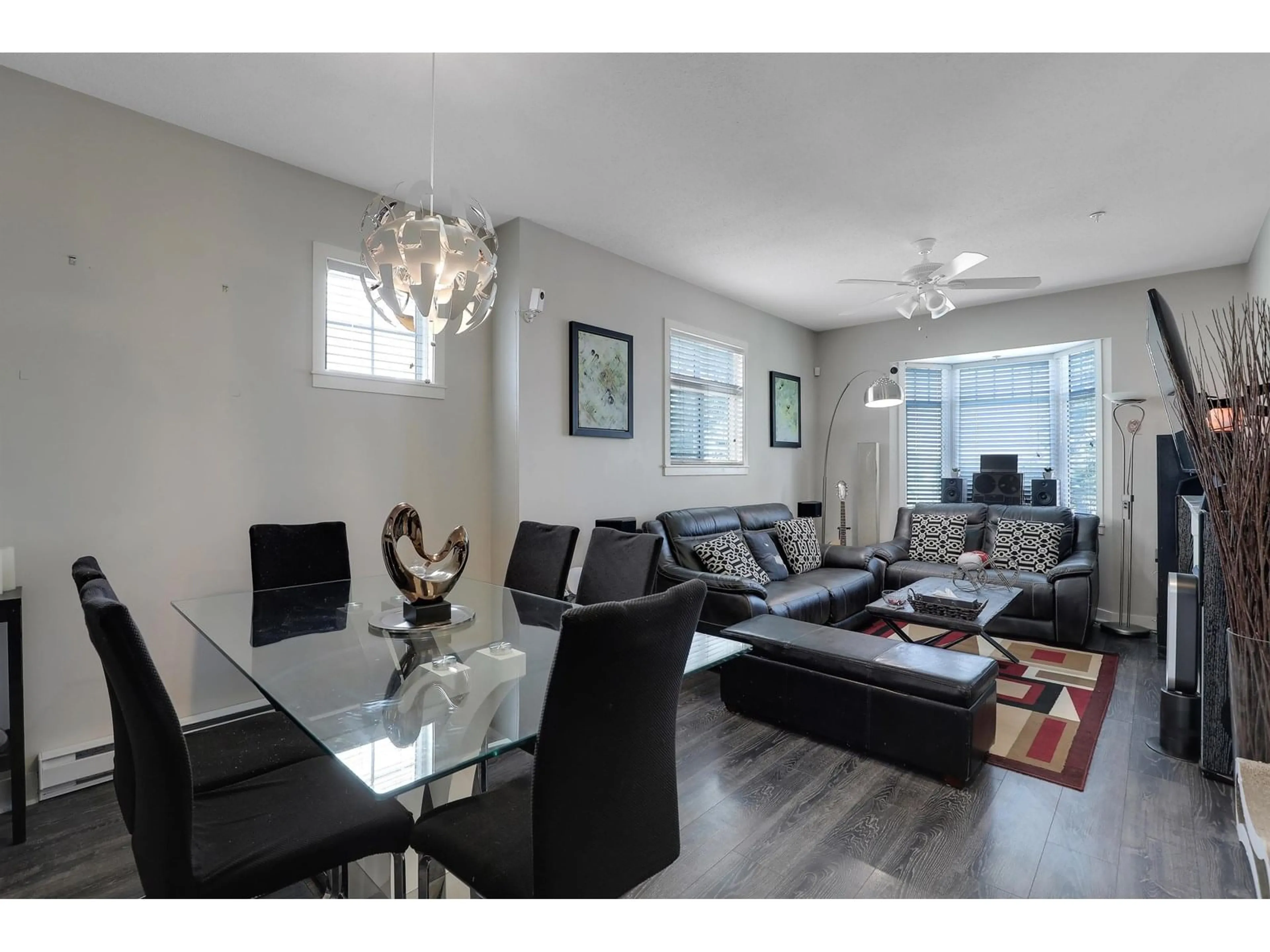 Living room with furniture, wood/laminate floor for 22 - 19551 66, Surrey British Columbia V4N0Z5