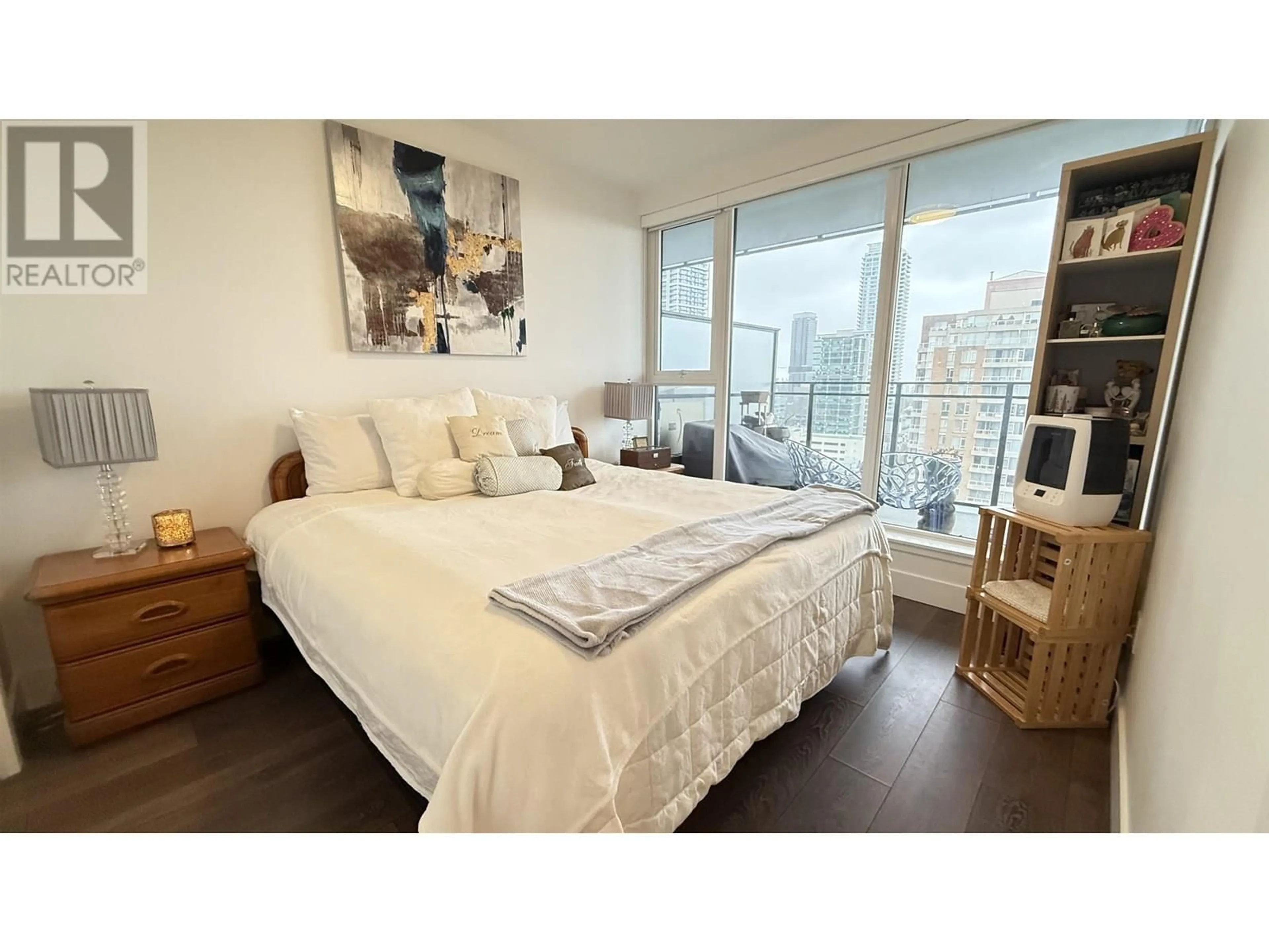 Bedroom with bed, wood/laminate floor for 1407 - 4711 HAZEL STREET, Burnaby British Columbia V5H0J9