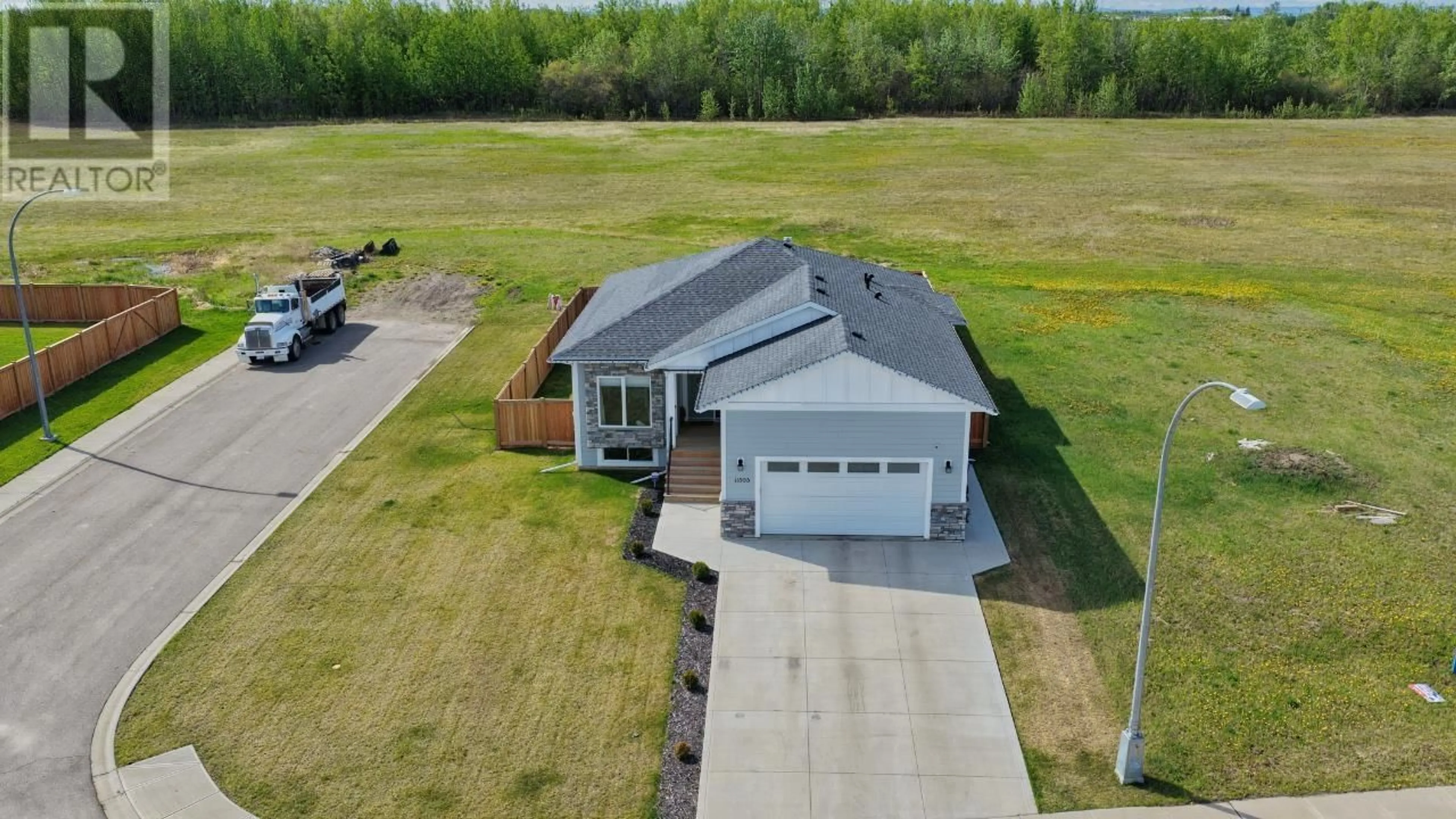 A pic from outside/outdoor area/front of a property/back of a property/a pic from drone, unknown for 11303 112 AVENUE, Fort St. John British Columbia V1J0R5