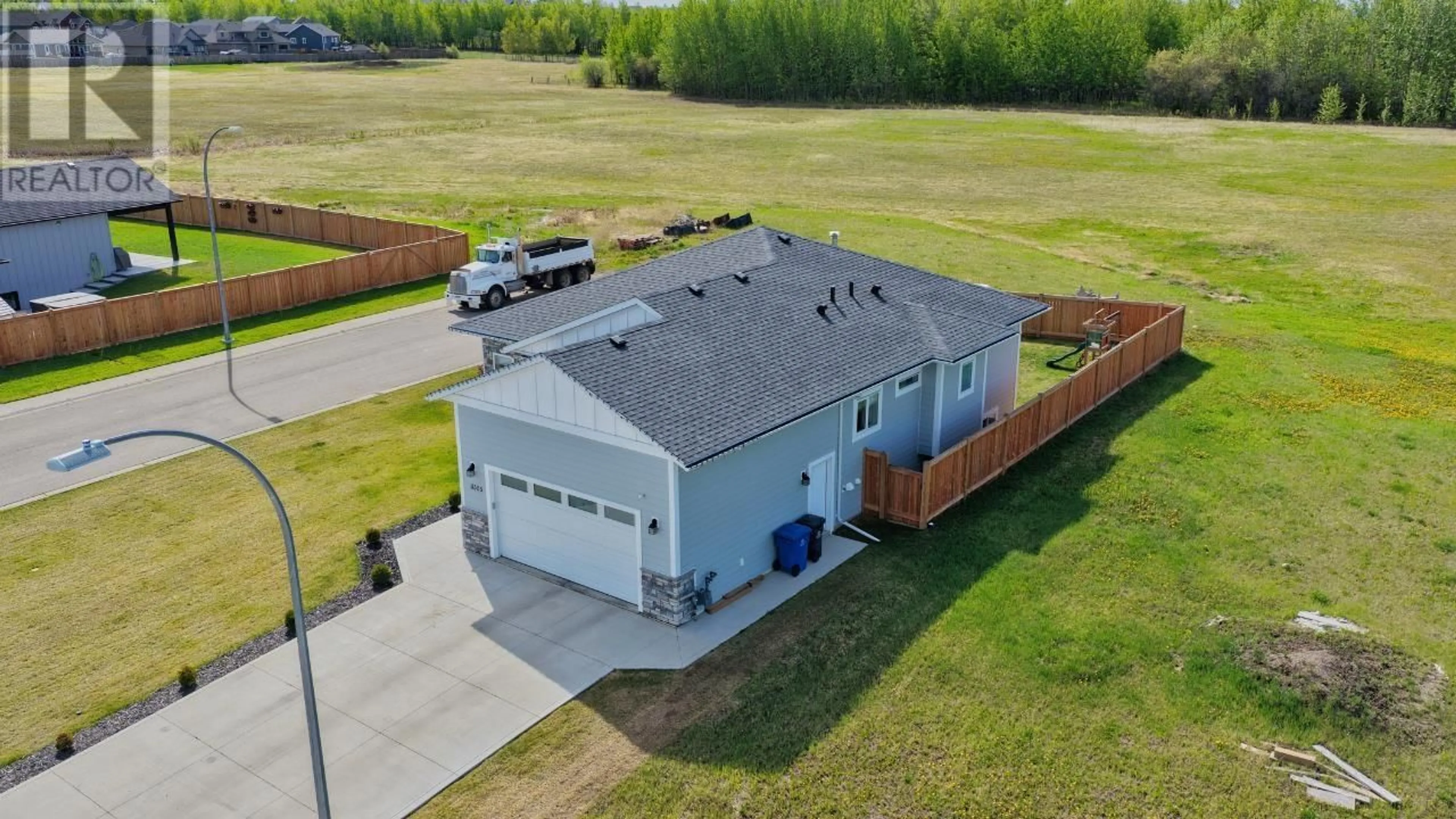A pic from outside/outdoor area/front of a property/back of a property/a pic from drone, building for 11303 112 AVENUE, Fort St. John British Columbia V1J0R5