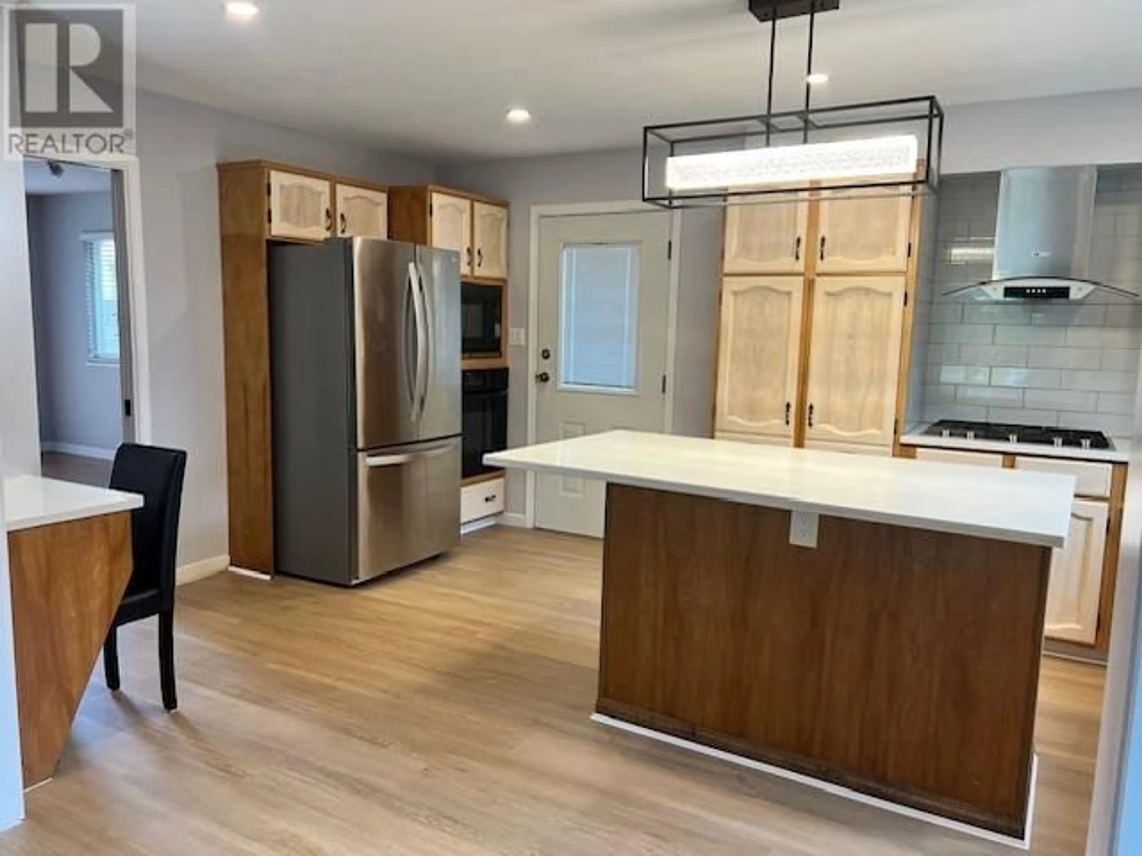 Open concept kitchen, wood/laminate floor for 4328 FORTUNE AVENUE, Richmond British Columbia V7E5P8