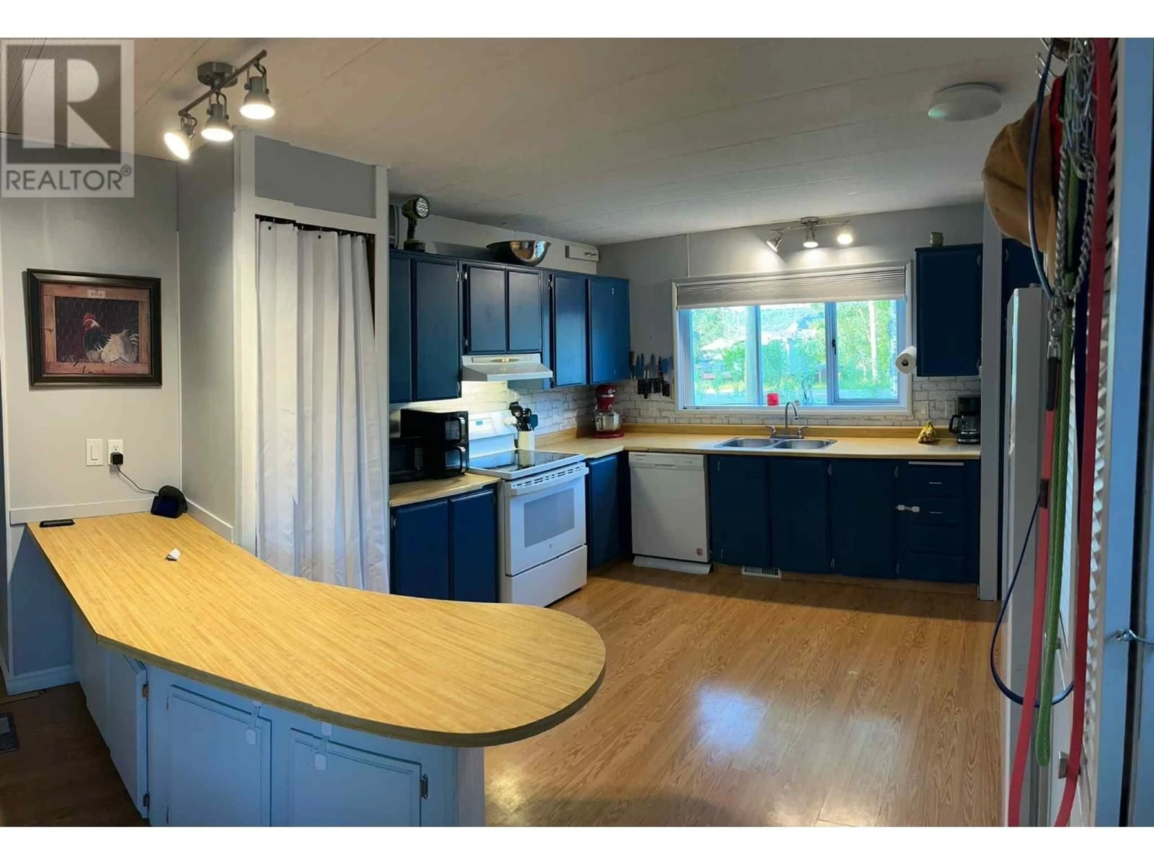 Open concept kitchen, wood/laminate floor for 1859 BLACKBURN ROAD, North Blackburn British Columbia V2N6B9