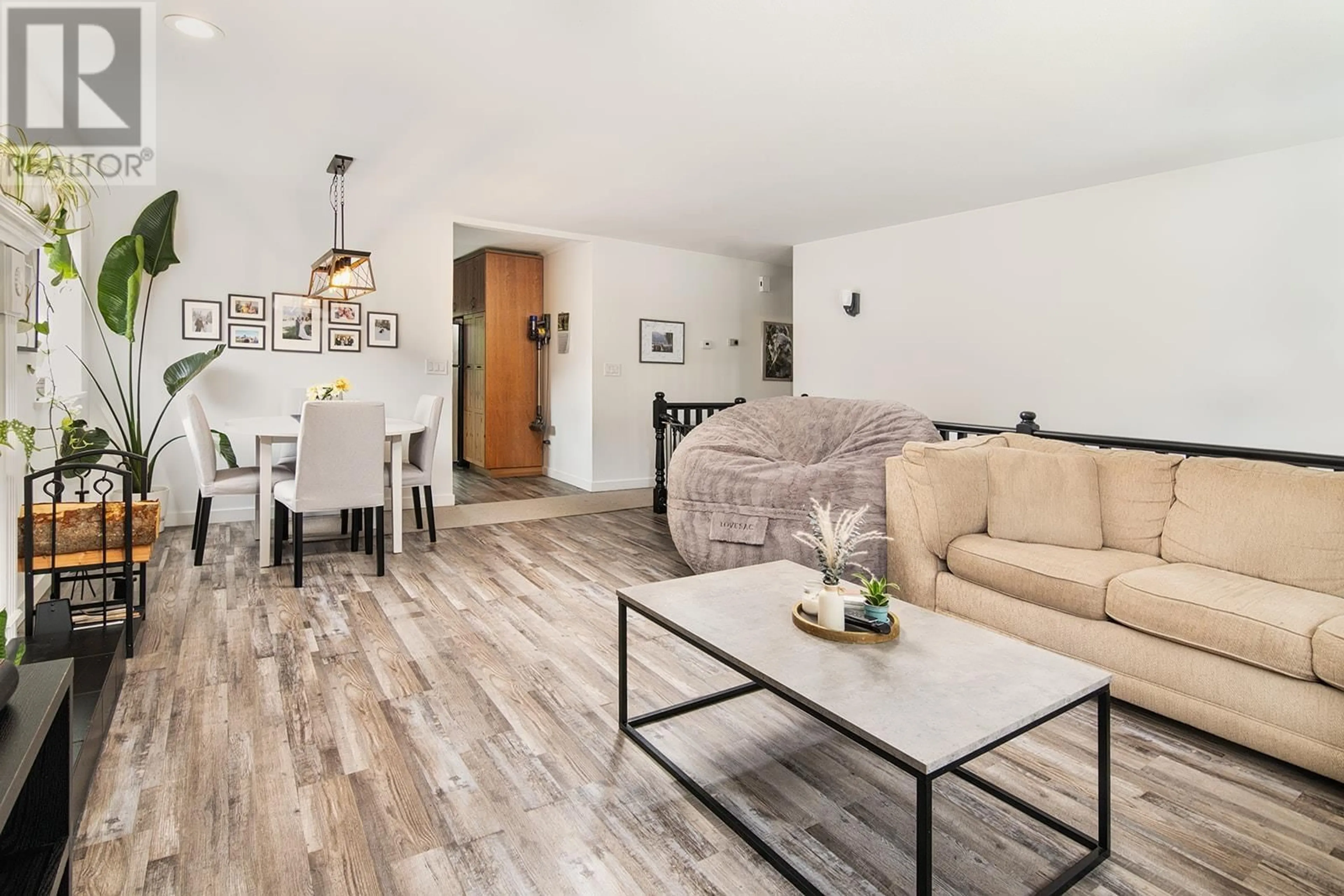Living room with furniture, wood/laminate floor for 7403 HARROW ROAD, Pemberton British Columbia V0N2L0
