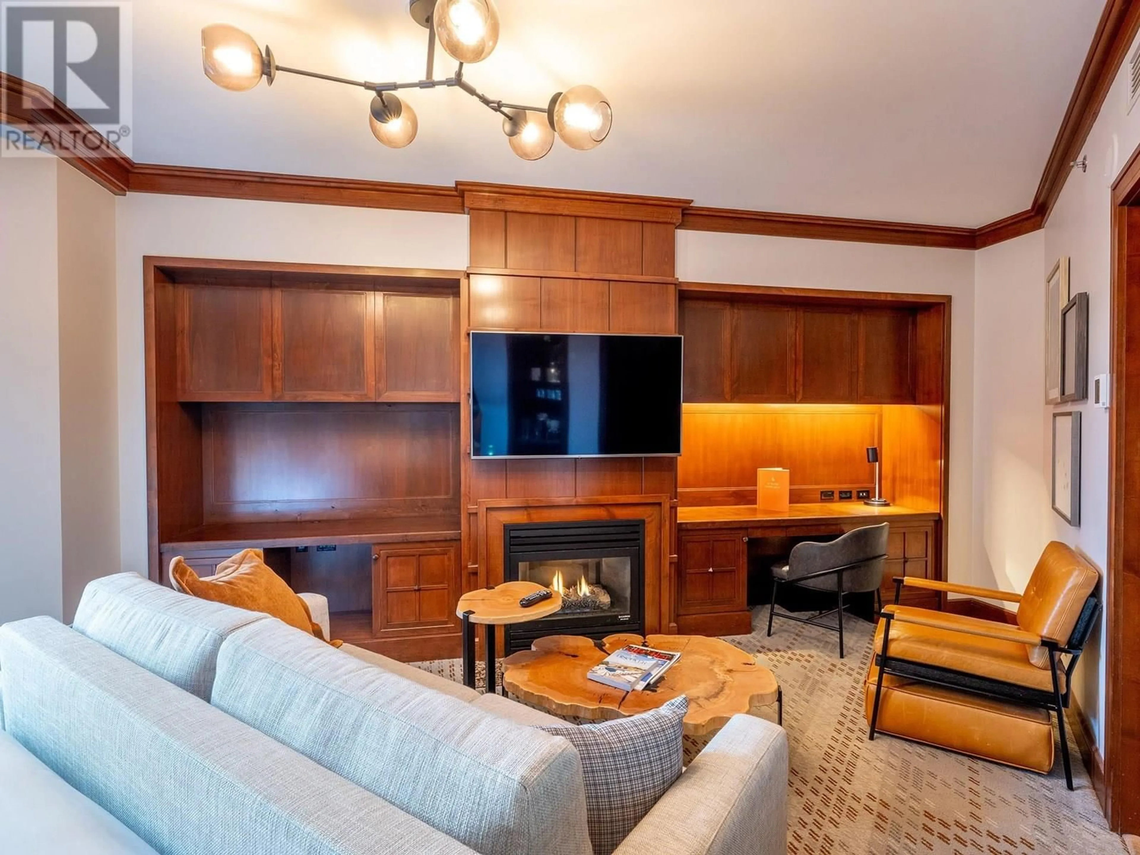 Living room with furniture, wood/laminate floor for 710 - 4591 BLACKCOMB WAY, Whistler British Columbia V8E0Y4