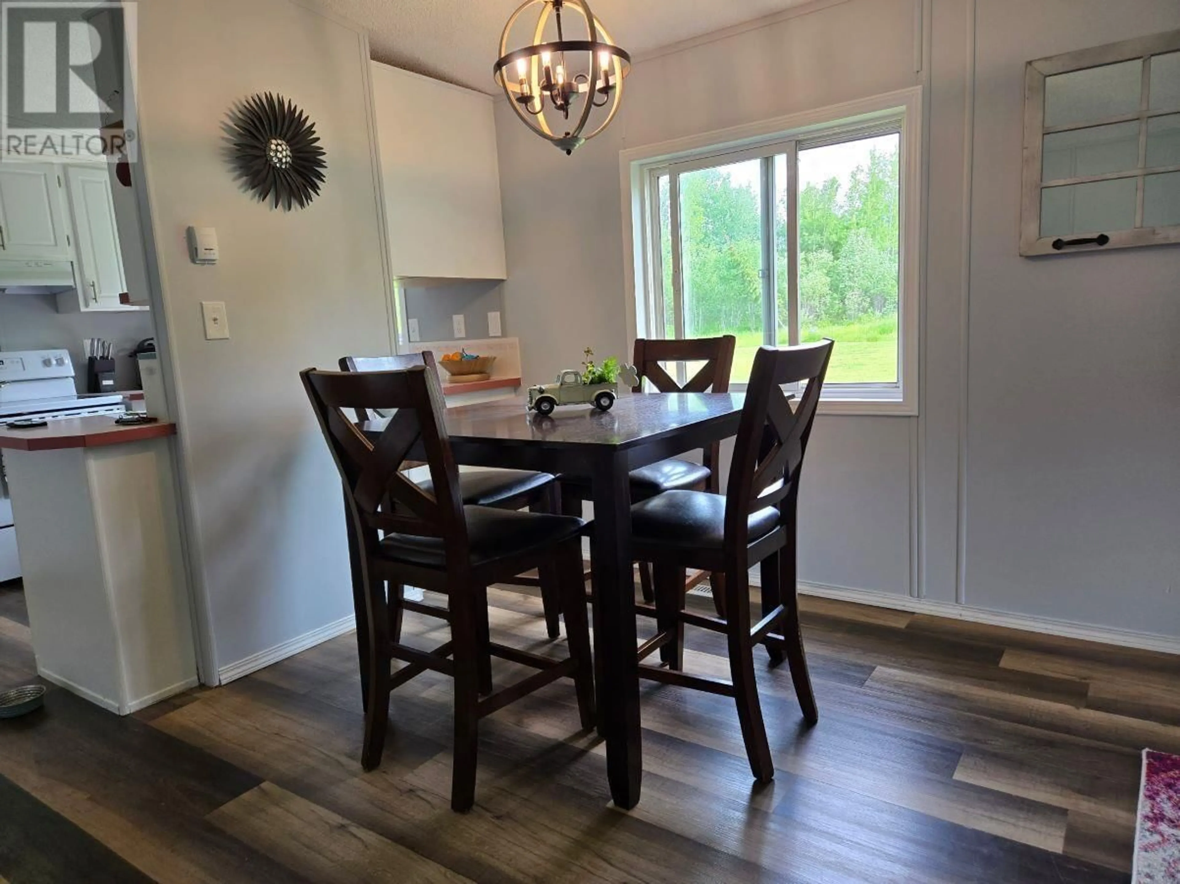 Dining room, wood/laminate floor for 6770 PARSNIP ROAD, Prince George British Columbia V2N6E8